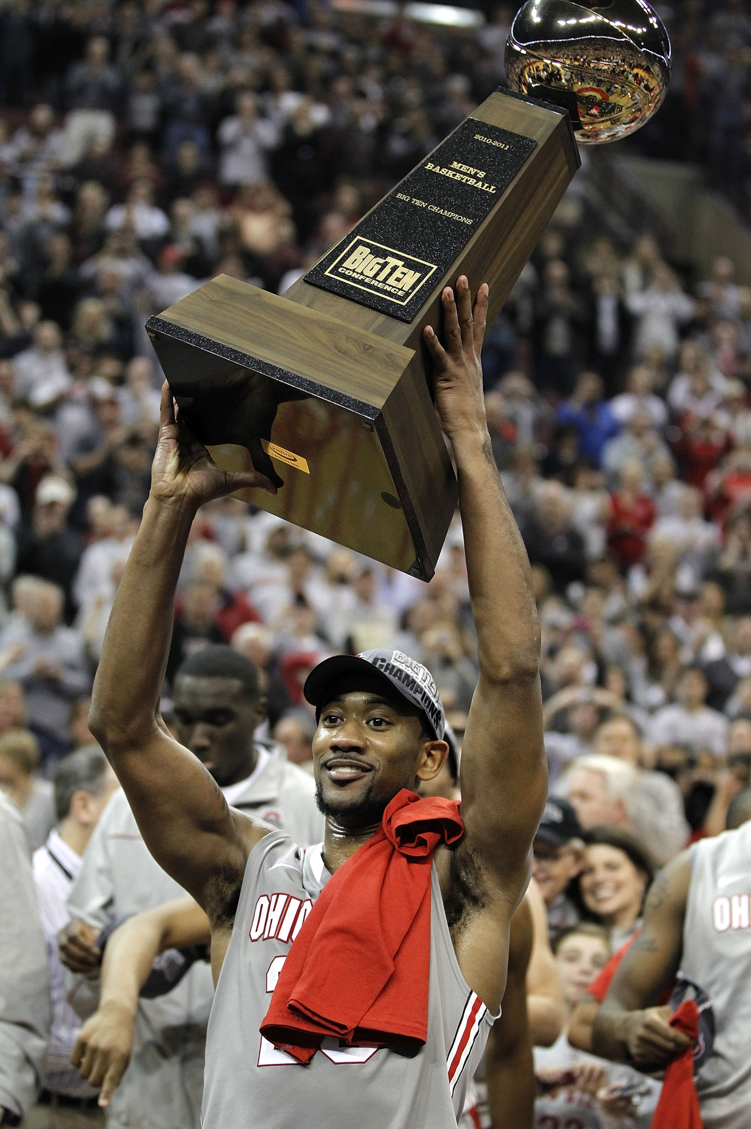 COLUMBUS, OH - MARCH 06: David Lighty #23 of the Ohio State Buckeyes raises the Big Ten trophy after beating the Wisconsin Badgers 93-65 on March 6, 2011 at the Value City Arena in Columbus, Ohio. (Photo by Gregory Shamus/Getty Images)