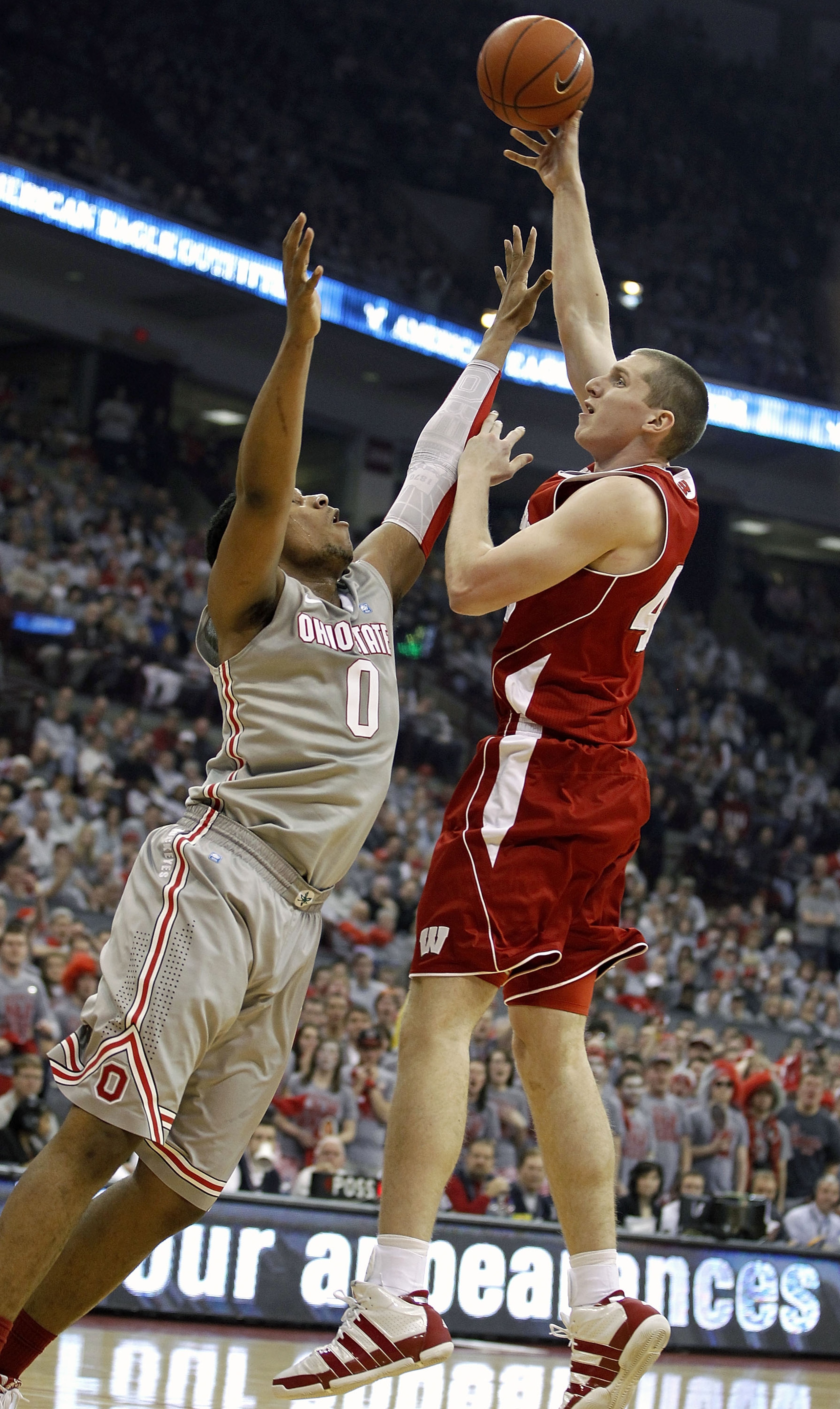 COLUMBUS, OH - MARCH 06: Jared Berggren #40 of the Wisconsin Badgers shoots over Jared Sullinger #0 of the Ohio State Buckeyeson March 6, 2011 at the Value City Arena in Columbus, Ohio. Ohio State won the game 93-65. (Photo by Gregory Shamus/Getty Images)