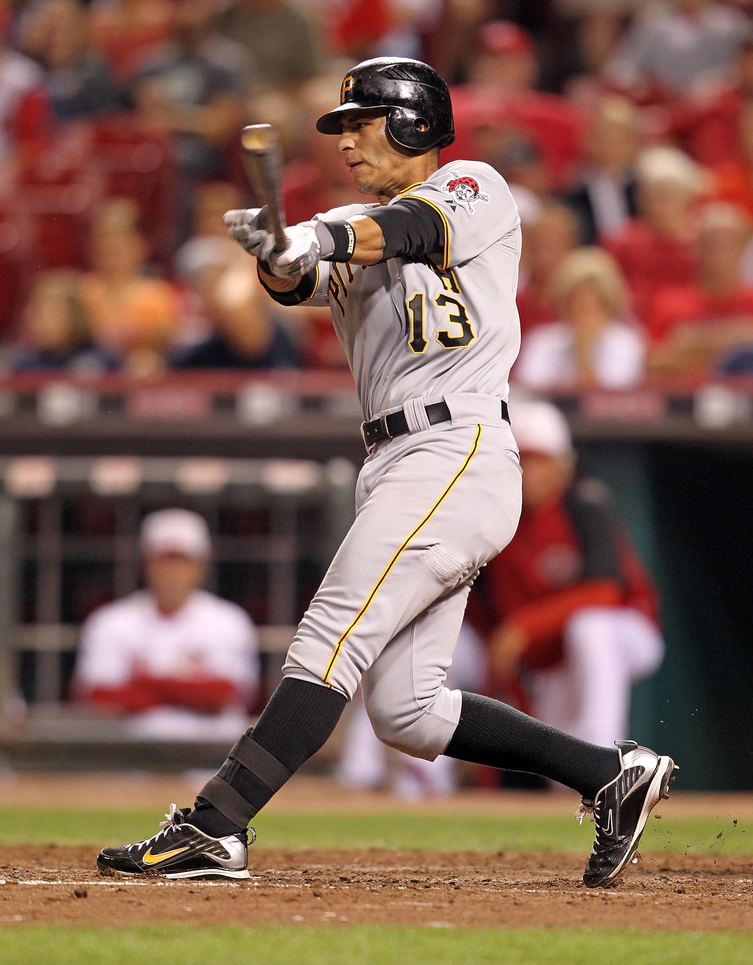 CINCINNATI - SEPTEMBER 11:  Ronny Cedeno #13 of the Pittsburg Pirates swings at a pitch during the game against the Cincinnati Reds at Great American Ball Park on September 11, 2010 in Cincinnati, Ohio.  (Photo by Andy Lyons/Getty Images)