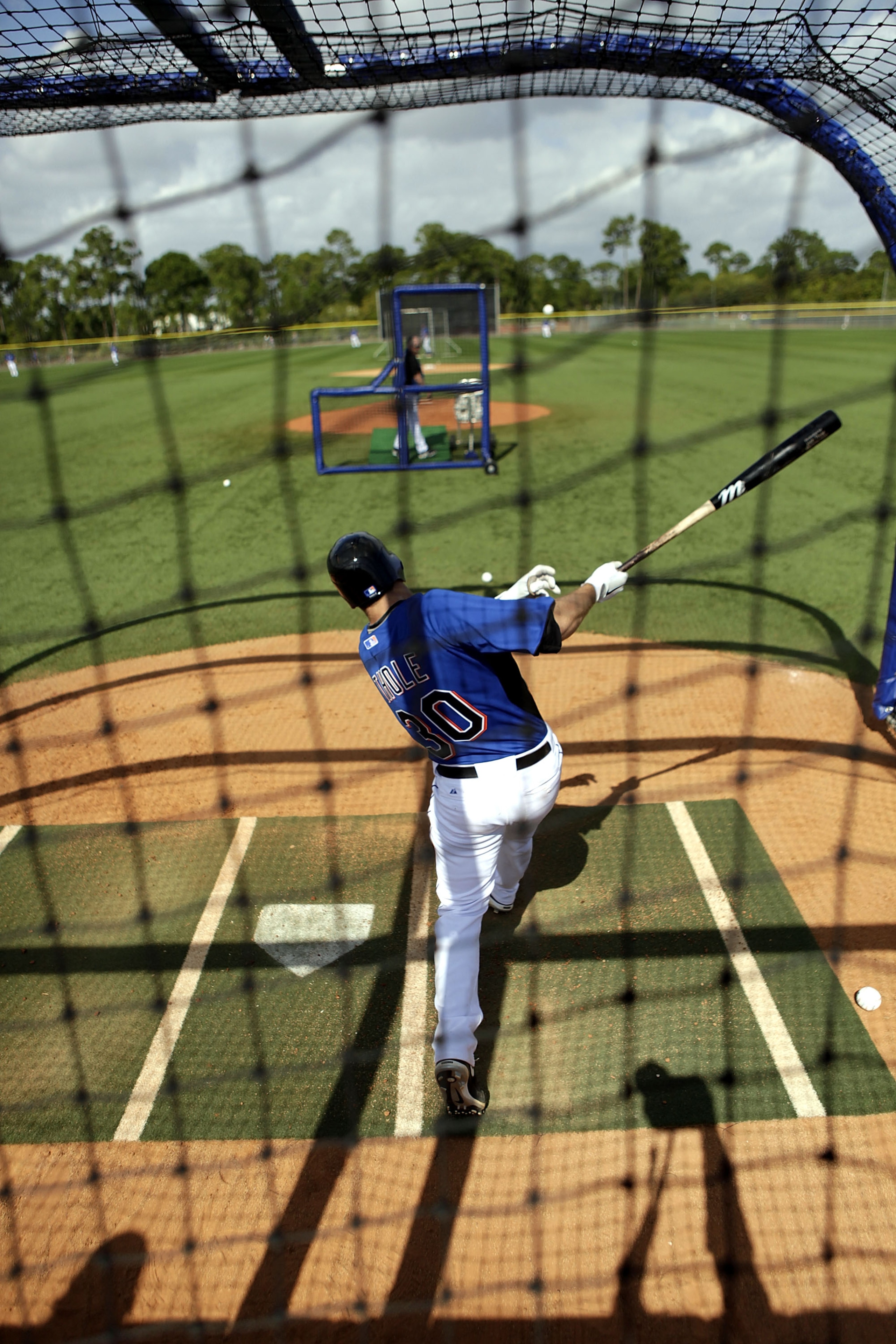 PORT ST. LUCIE, FL - FEBRUARY 17:  Catcher Josh Thole #30 of the New York Mets bats during spring training at Tradition Field on February 17, 2011 in Port St. Lucie, Florida.  (Photo by Marc Serota/Getty Images)