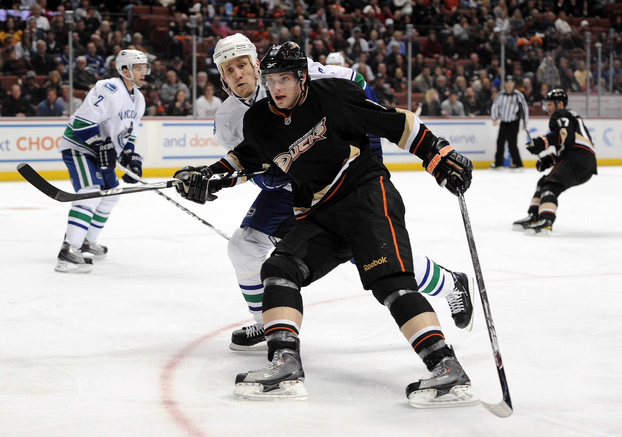 ANAHEIM, CA - MARCH 06:  Bobby Ryan #9 of the Anaheim Ducks and Sami Salo #6 of the Vancouver Canucks  head to the corner for the puck at the Honda Center on March 6, 2011 in Anaheim, California.  (Photo by Harry How/Getty Images)