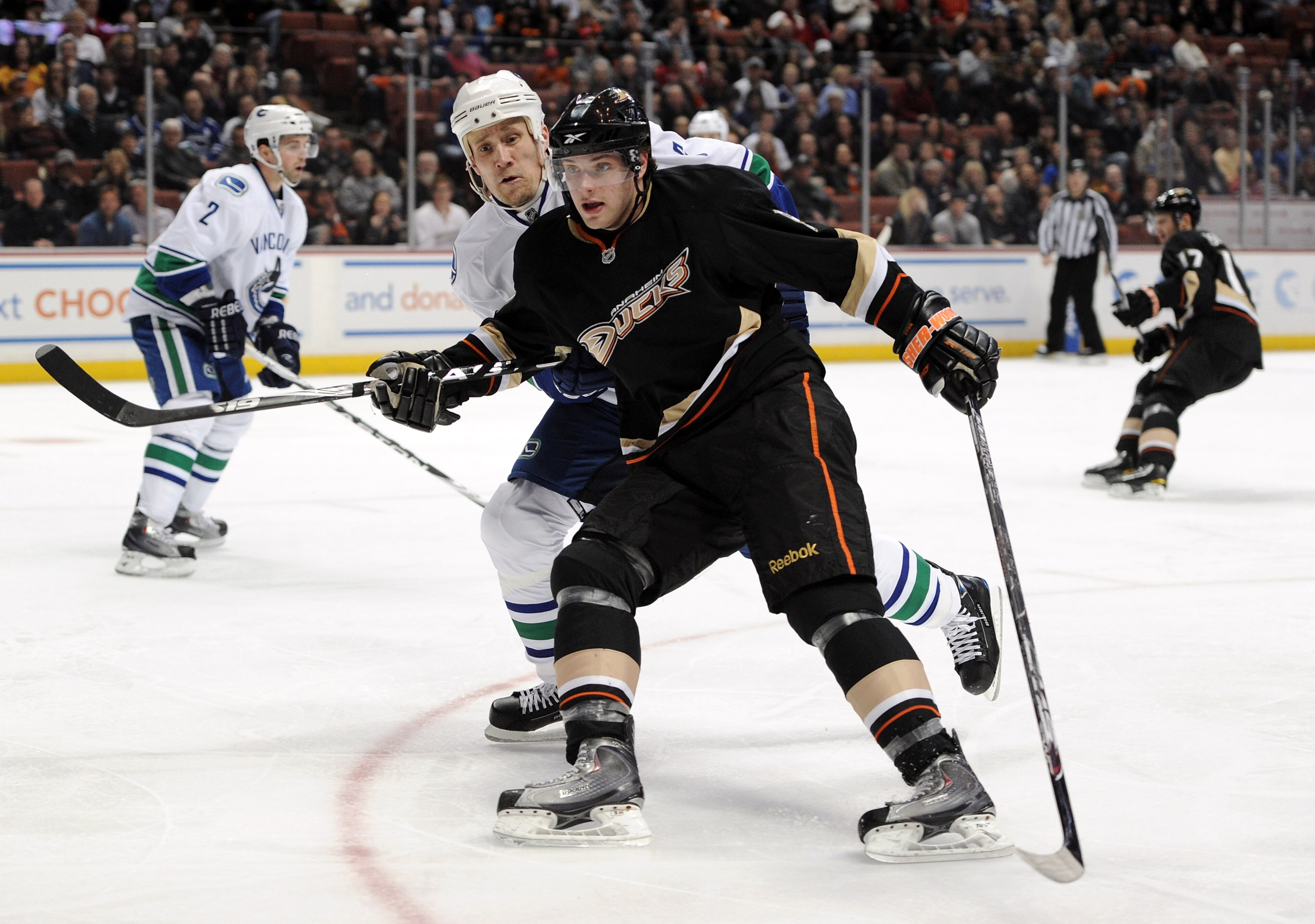 ANAHEIM, CA - MARCH 06:  Bobby Ryan #9 of the Anaheim Ducks and Sami Salo #6 of the Vancouver Canucks  head to the corner for the puck at the Honda Center on March 6, 2011 in Anaheim, California.  (Photo by Harry How/Getty Images)