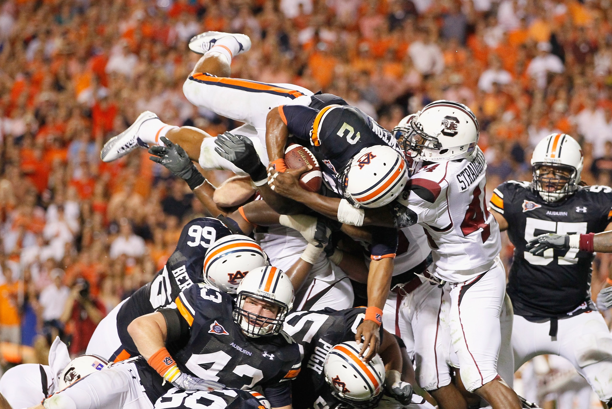AUBURN, AL - SEPTEMBER 25:  Quarterback Cameron Newton #2 of the Auburn Tigers dives across the offensive and defensive lines for a touchdown against the South Carolina Gamecocks before it was called back for a false start at Jordan-Hare Stadium on Septem