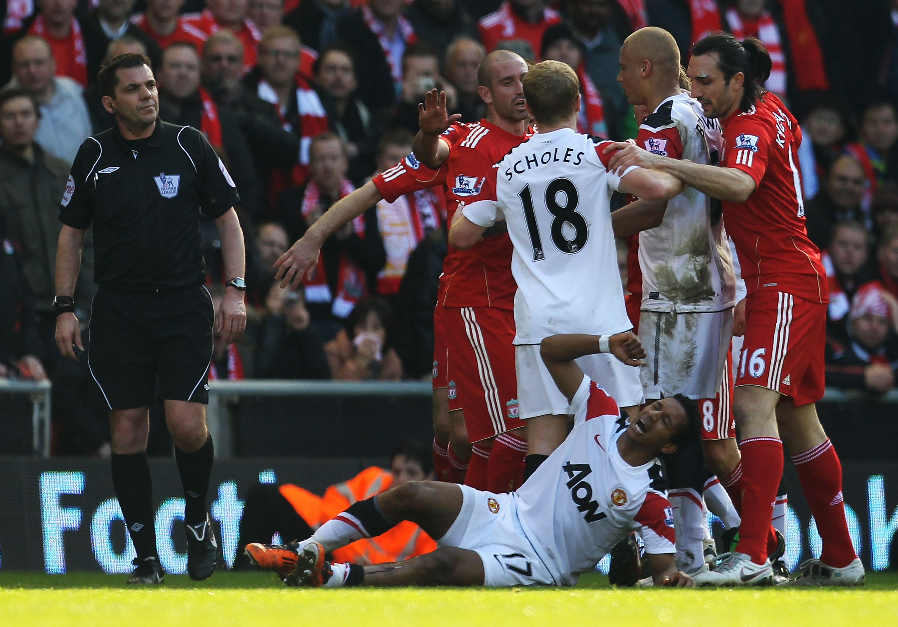 LIVERPOOL, UNITED KINGDOM - MARCH 06:  Nani of Manchester United lies on the pitch following a challenge by Jamie Carragher of Liverpool during the Barclays Premier League match between Liverpool and Manchester United at Anfield on March 6, 2011 in Liverp