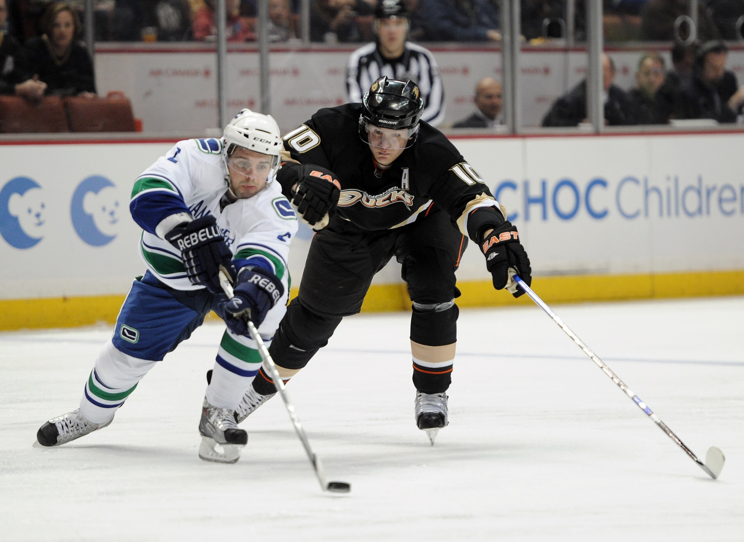ANAHEIM, CA - MARCH 06:  Corey Perry #10 of the  Anaheim Ducks chases after Dan Hamhuis #2 of the Vancouver Canucks at the Honda Center on March 6, 2011 in Anaheim, California.  (Photo by Harry How/Getty Images)
