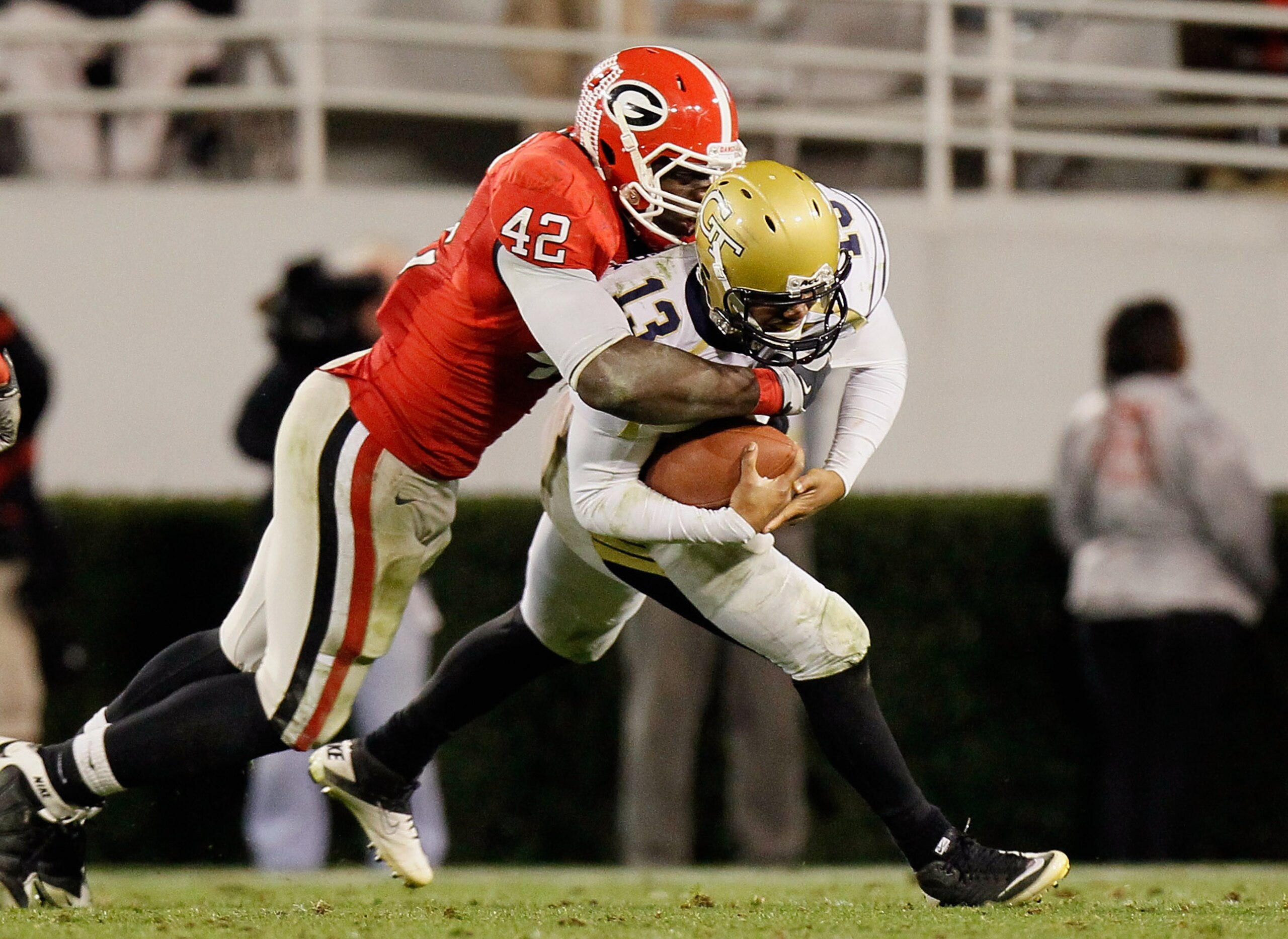 ATHENS, GA - NOVEMBER 27:  Justin Houston #42 of the Georgia Bulldogs sacks quarterback Tevin Washington #13 of the Georgia Tech Yellow Jackets at Sanford Stadium on November 27, 2010 in Athens, Georgia.  (Photo by Kevin C. Cox/Getty Images)