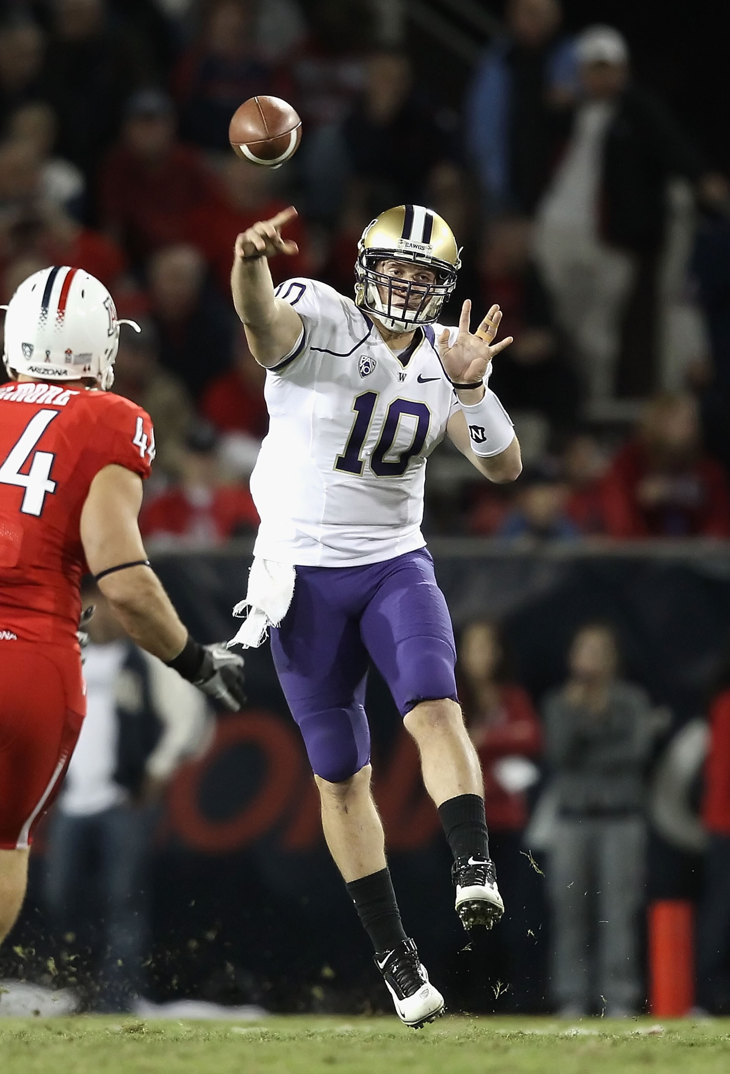 TUCSON, AZ - OCTOBER 23:  Quarterback Jake Locker #10 of the Washington Huskies drops back to pass during the college football game against the Arizona Wildcats at Arizona Stadium on October 23, 2010 in Tucson, Arizona. The Wildcats defeated the Huskies 4