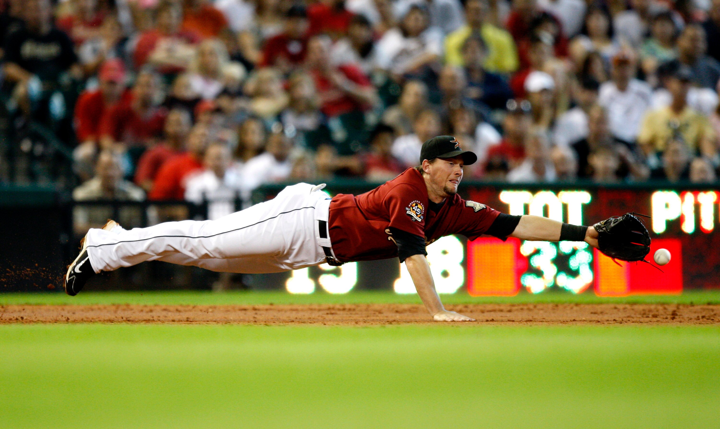 HOUSTON - AUGUST 15:  Third baseman Chris Johnson #23 of the Houston Astrosn dives but comes up short on a hard hit ball by Chris Snyder #19 of the Pittsburgh Pirates in the third inning at Minute Maid Park on August 15, 2010 in Houston, Texas.  (Photo by