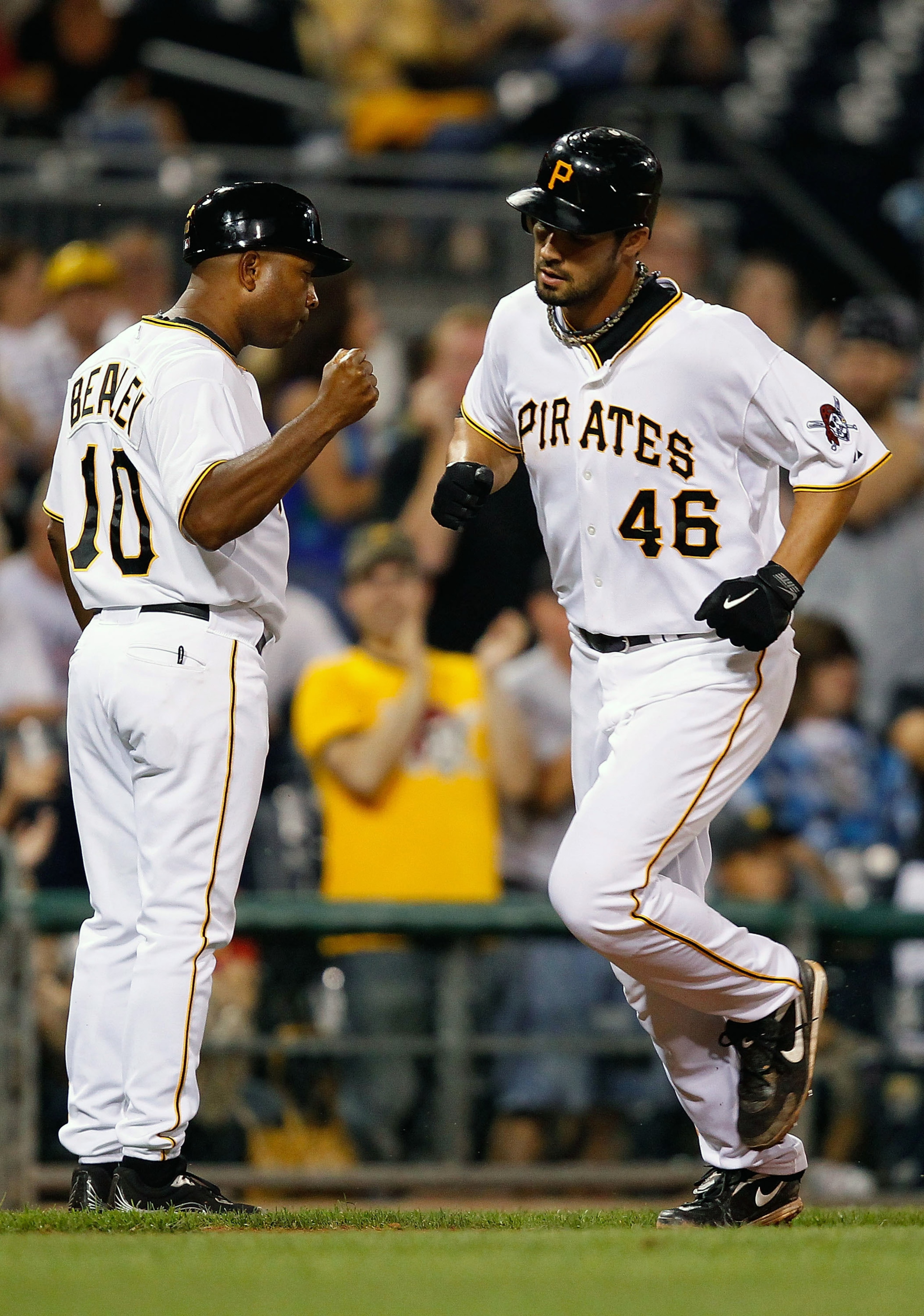 PITTSBURGH - AUGUST 25:  Garrett Jones #46 is congratulated by third base coach Tony Beasley #10 of the Pittsburgh Pirates after hitting a solo home run in the 8th inning against the St Louis Cardinals  during the game on August 25, 2010 at PNC Park in Pi