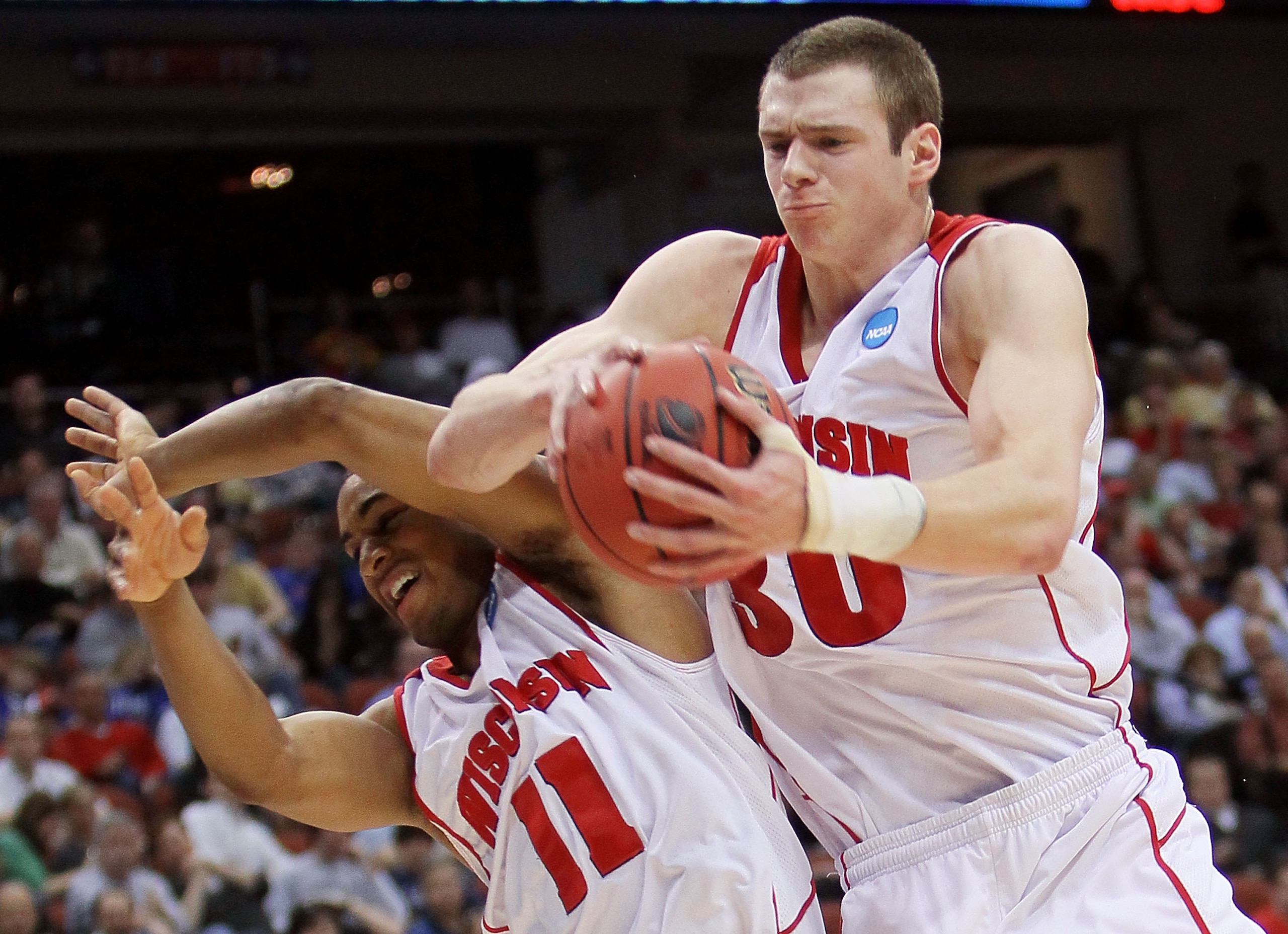 JACKSONVILLE, FL - MARCH 19:  Jon Leuer #30 and Jordan Taylor #11 of the Wisconsin Badgers battle for a rebound against the Wofford Terriers during the first round of the 2010 NCAA men's basketball tournament at Jacksonville Veteran's Memorial Arena on Ma