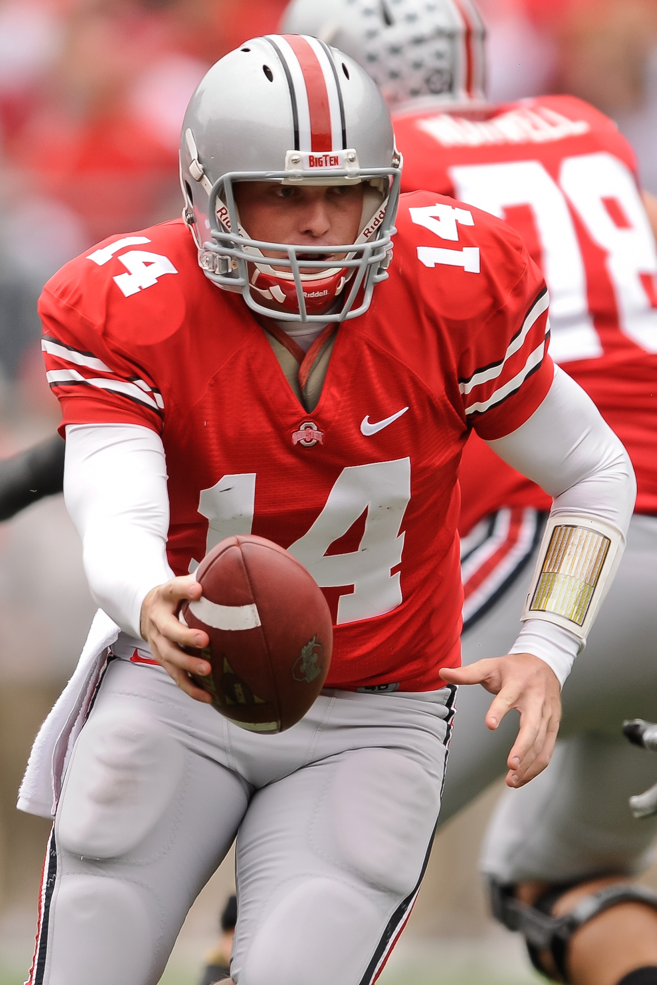 COLUMBUS, OH - OCTOBER 23:  Joe Bauserman #14 of the Ohio State Buckeyes hands off the ball against the Purdue Boilermakers at Ohio Stadium on October 23, 2010 in Columbus, Ohio.  (Photo by Jamie Sabau/Getty Images)