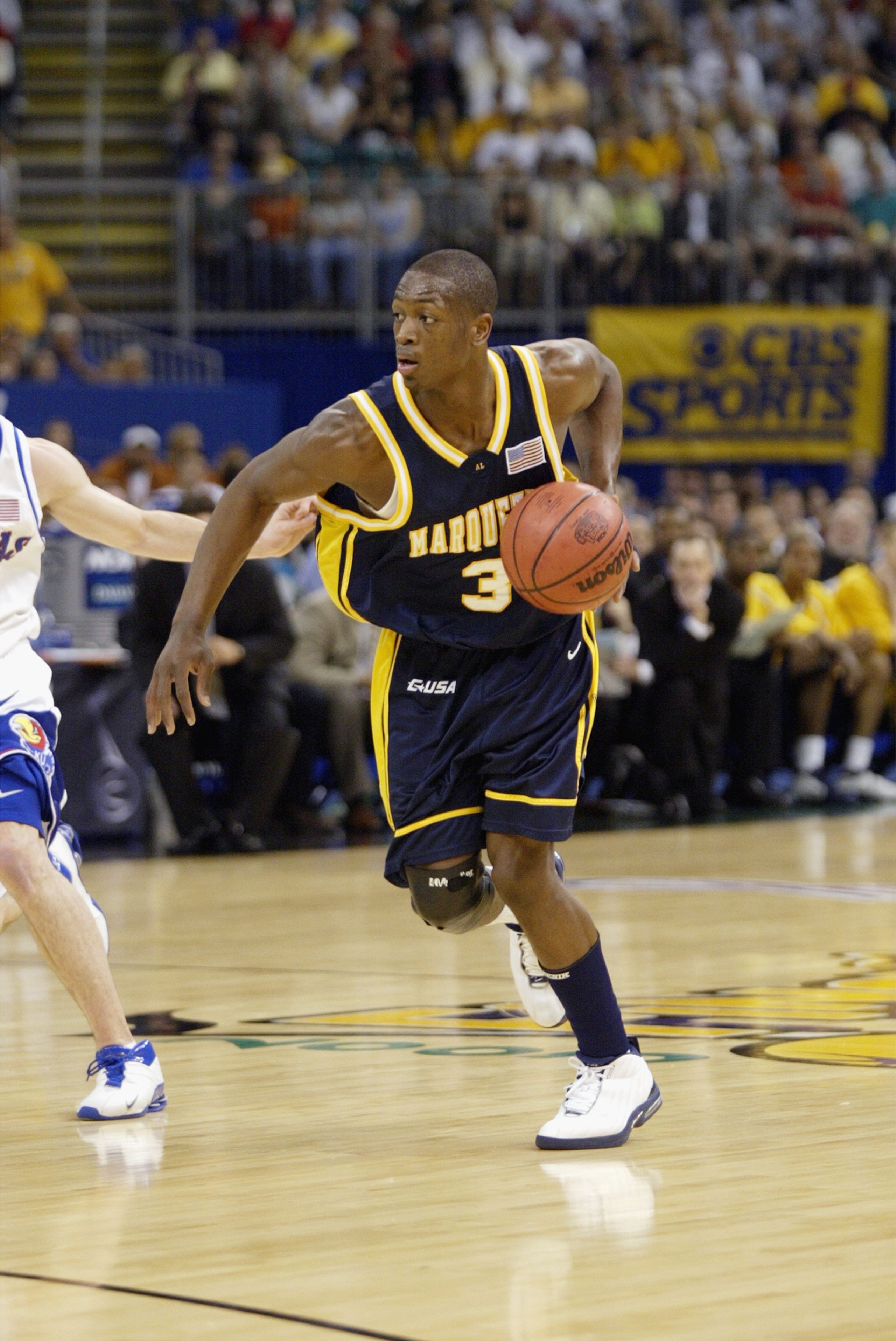 NEW ORLEANS - APRIL 5:  Dwyane Wade #3 of Marquette University Golden Eagles advances the ball during the semifinal round of the NCAA Final Four Tournament against the University of Kansas Jayhawks at the Louisiana Superdome on April 5, 2003 in New Orlean