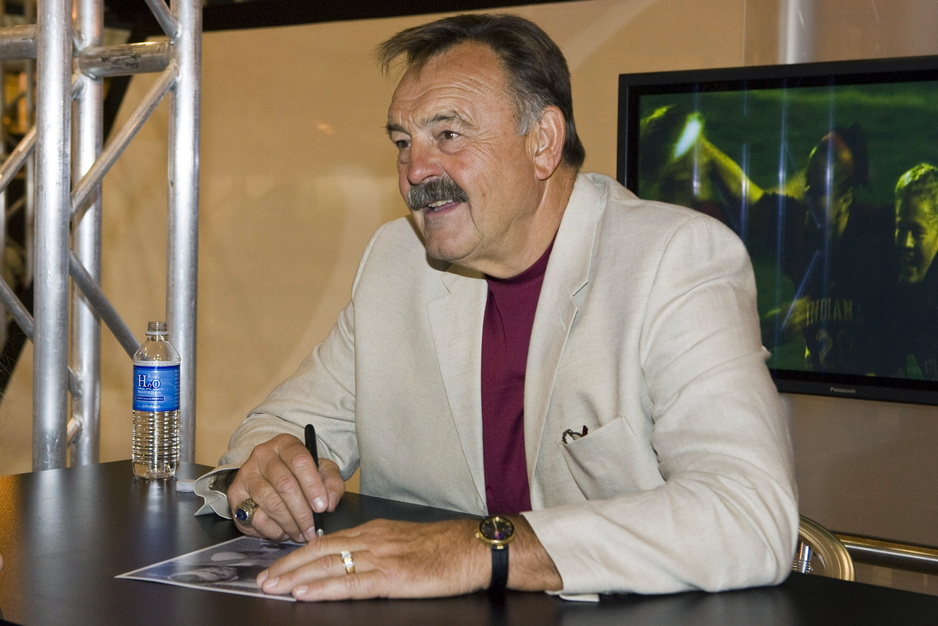 NEW ORLEANS - MAY 19: 2008 Pro Football Hall of Fame member and legendary Chicago Bears linebacker Dick Butkus takes time to sign footballs for fans in the Fox Cable Networks' booth at the The Cable Show in the Ernest N. Morial Convention Center on May 19