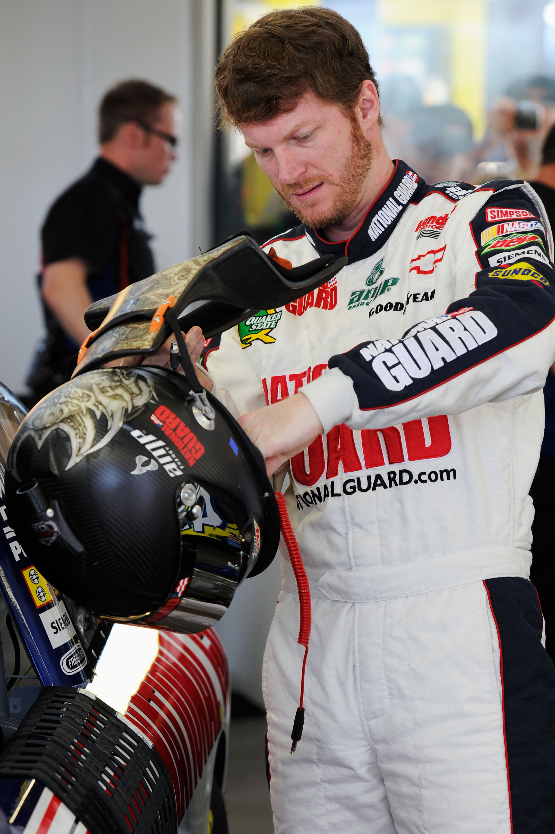 LAS VEGAS, NV - MARCH 05:  Dale Earnhardt Jr., driver of the #88 National Guard/Amp Energy Chevrolet, stands in the garage during practice for the NASCAR Sprint Cup Series Kobalt Tools 400 at Las Vegas Motor Speedway on March 5, 2011 in Las Vegas, Nevada.