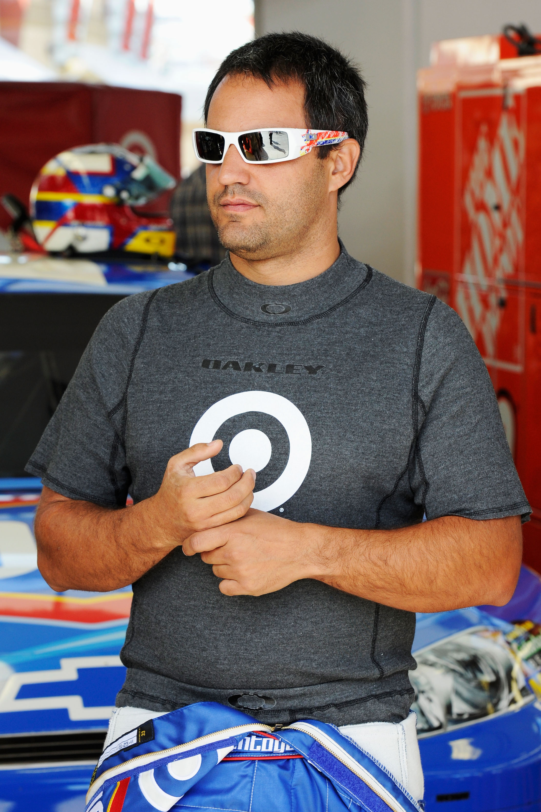LAS VEGAS, NV - MARCH 05:  Juan Pablo Montoya, driver of the #42 Clorox Chevrolet, walks in the garage during practice for the NASCAR Sprint Cup Series Kobalt Tools 400 at Las Vegas Motor Speedway on March 5, 2011 in Las Vegas, Nevada.  (Photo by John Har