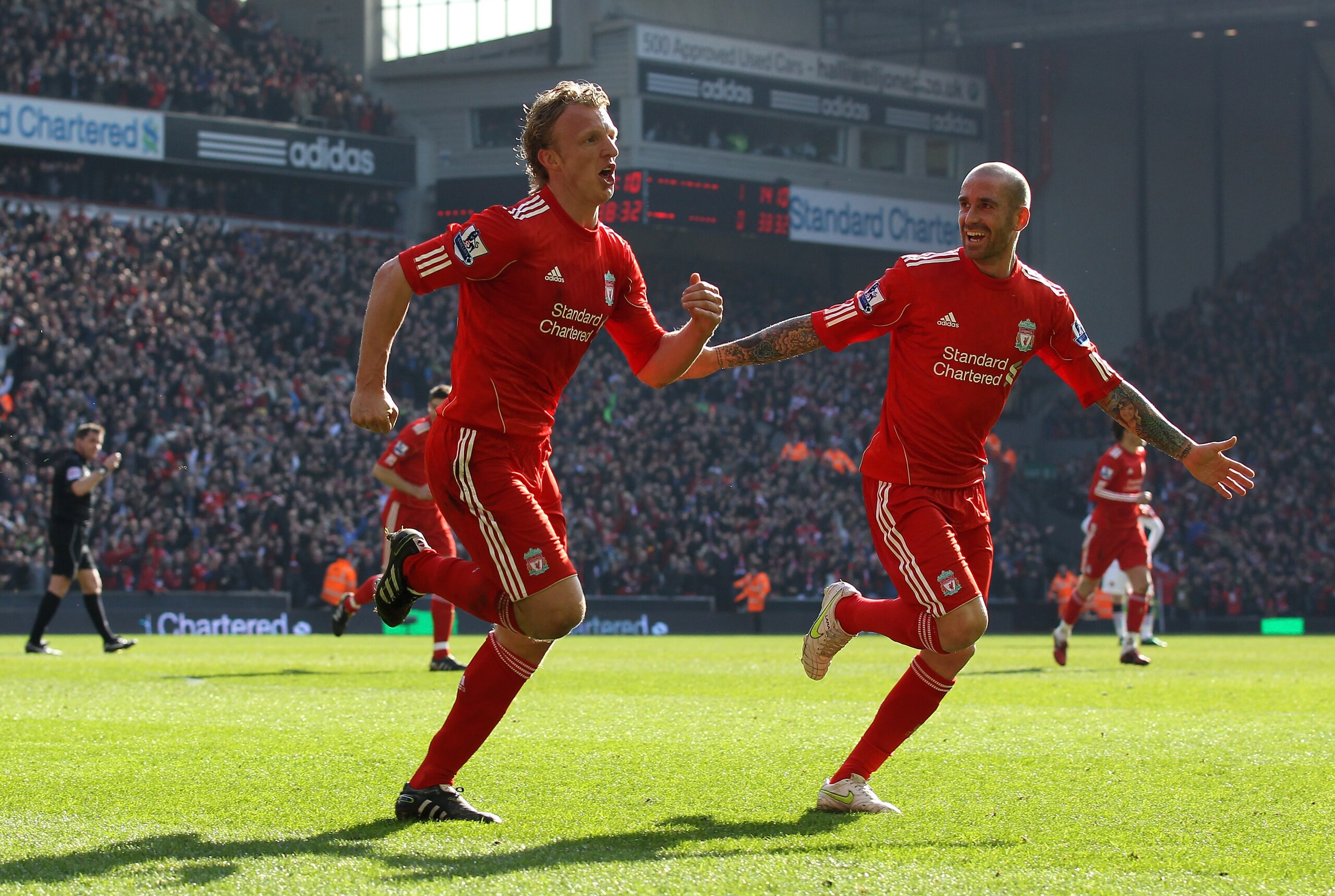 LIVERPOOL, ENGLAND - MARCH 06:  Dirk Kuyt of Liverpool celebrates scoring his team's second goal with team mate Raul Meireles (R) during the Barclays Premier League match between Liverpool and Manchester United at Anfield on March 6, 2011 in Liverpool, En