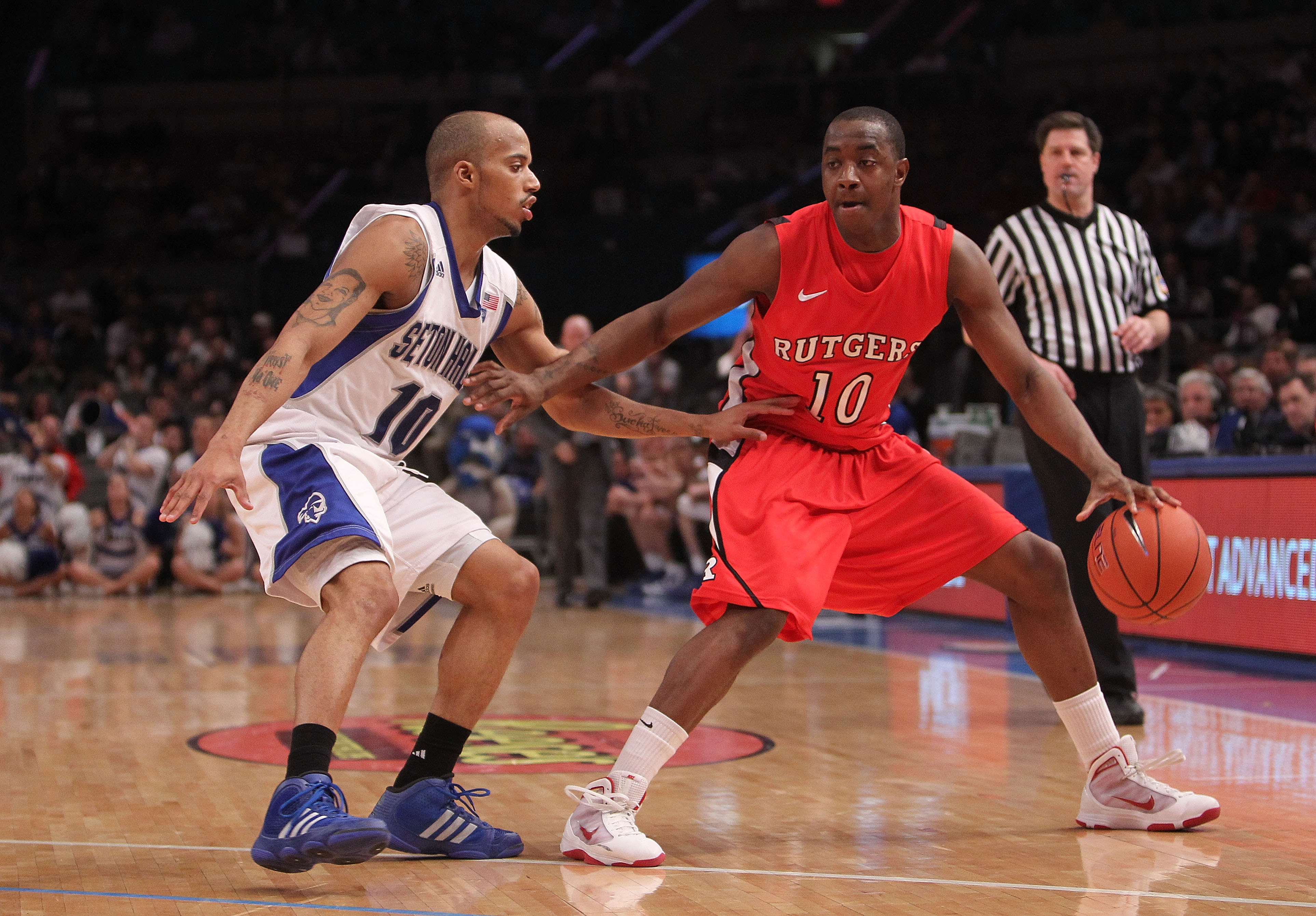 NEW YORK, NY - MARCH 08: Jordan Theodore #10 of the Seton Hall Pirates guards James Beatty #10 of the Rutgers Scarlet Knights at Madison Square Garden on March 8, 2011 in New York City. (Photo by Nick Laham/Getty Images)