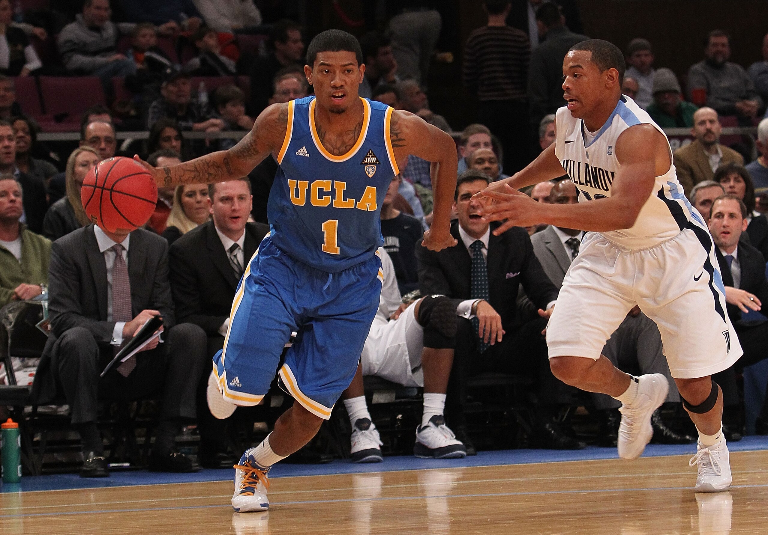 NEW YORK - NOVEMBER 24:  Tyler Lamb #1 of the UCLA Bruins drives to the basket past Corey Fisher #10 the Villanova Wildcats during their preseason NIT semifinal at Madison Square Garden on November 24, 2010 in New York City.  (Photo by Nick Laham/Getty Im