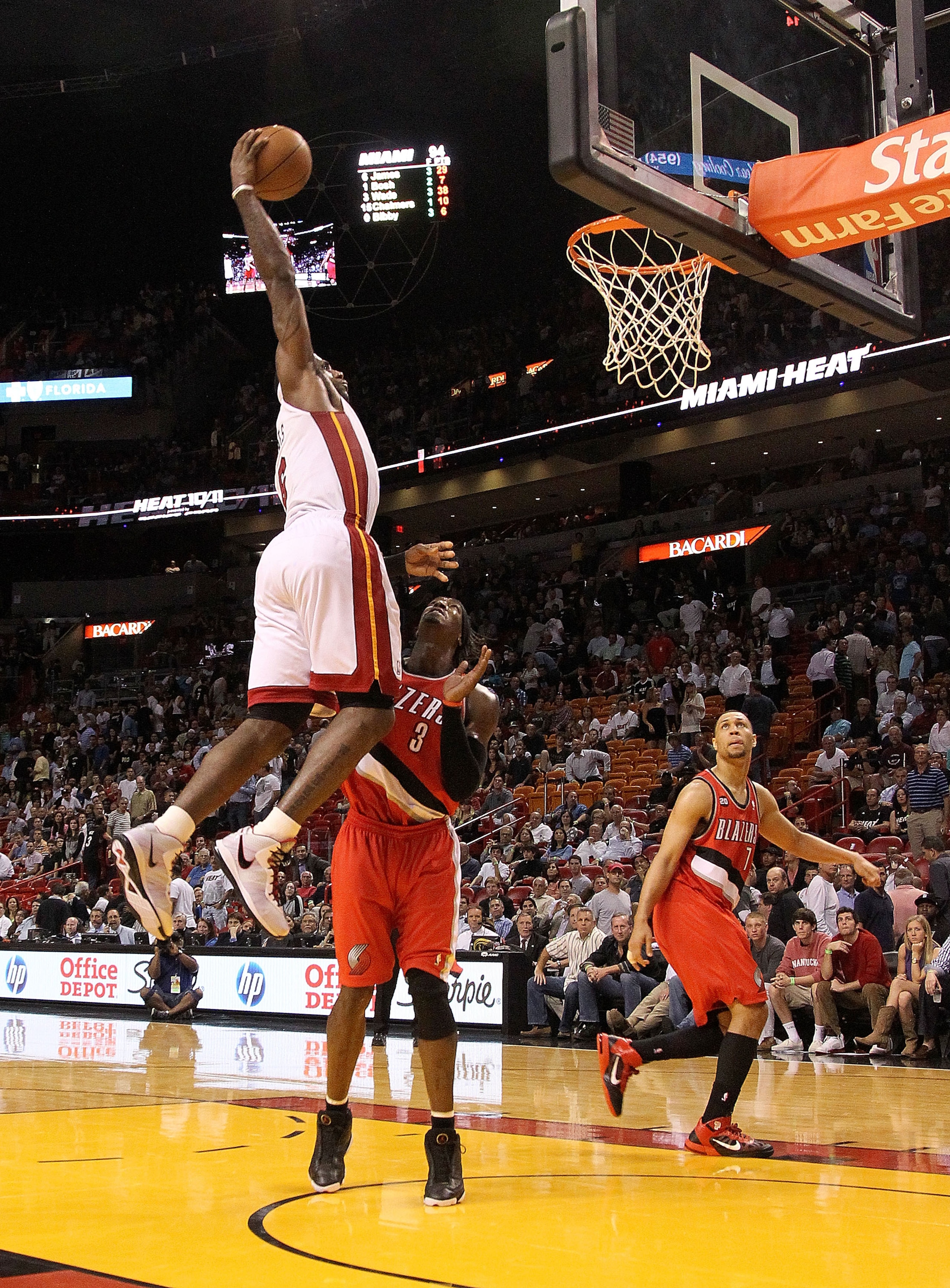 MIAMI, FL - MARCH 08:  LeBron James #6 of the Miami Heat dunks over Gerald Wallace #3 of the Portland Trail Blazers during a game at American Airlines Arena on March 8, 2011 in Miami, Florida. NOTE TO USER: User expressly acknowledges and agrees that, by