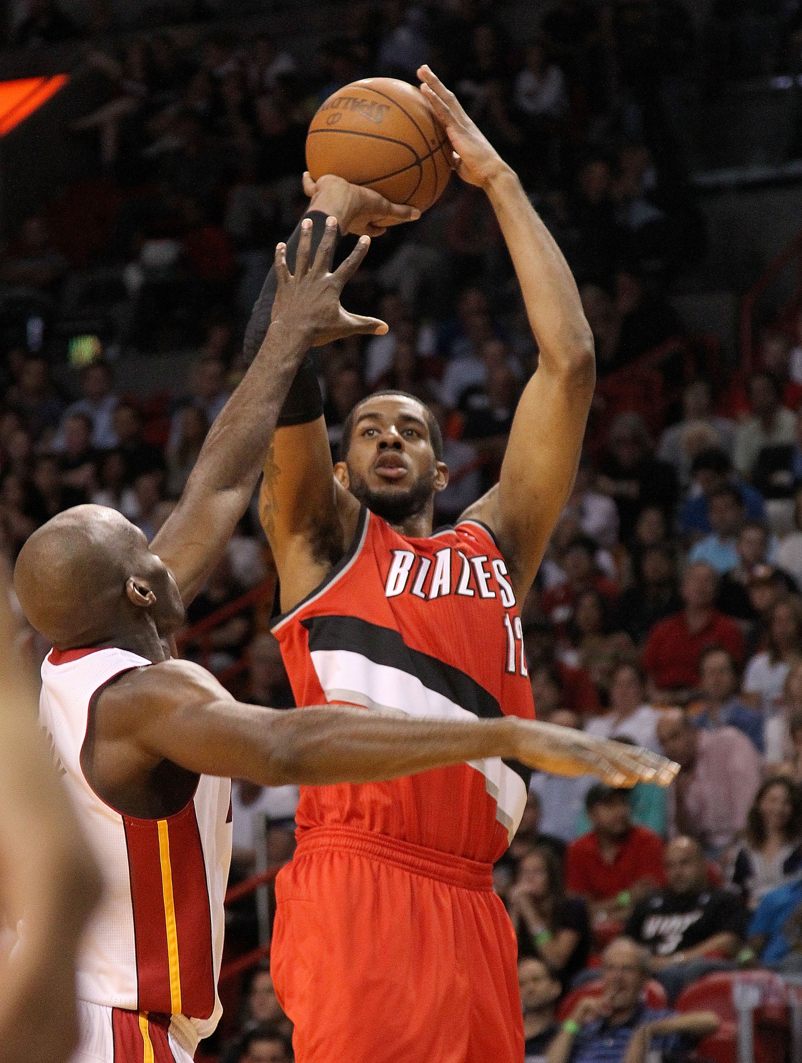 MIAMI, FL - MARCH 08:  LaMarcus Aldridge #12 of the Portland Trail Blazers shoots over Joel Anthony #50 of the Miami Heat during a game at American Airlines Arena on March 8, 2011 in Miami, Florida. NOTE TO USER: User expressly acknowledges and agrees tha