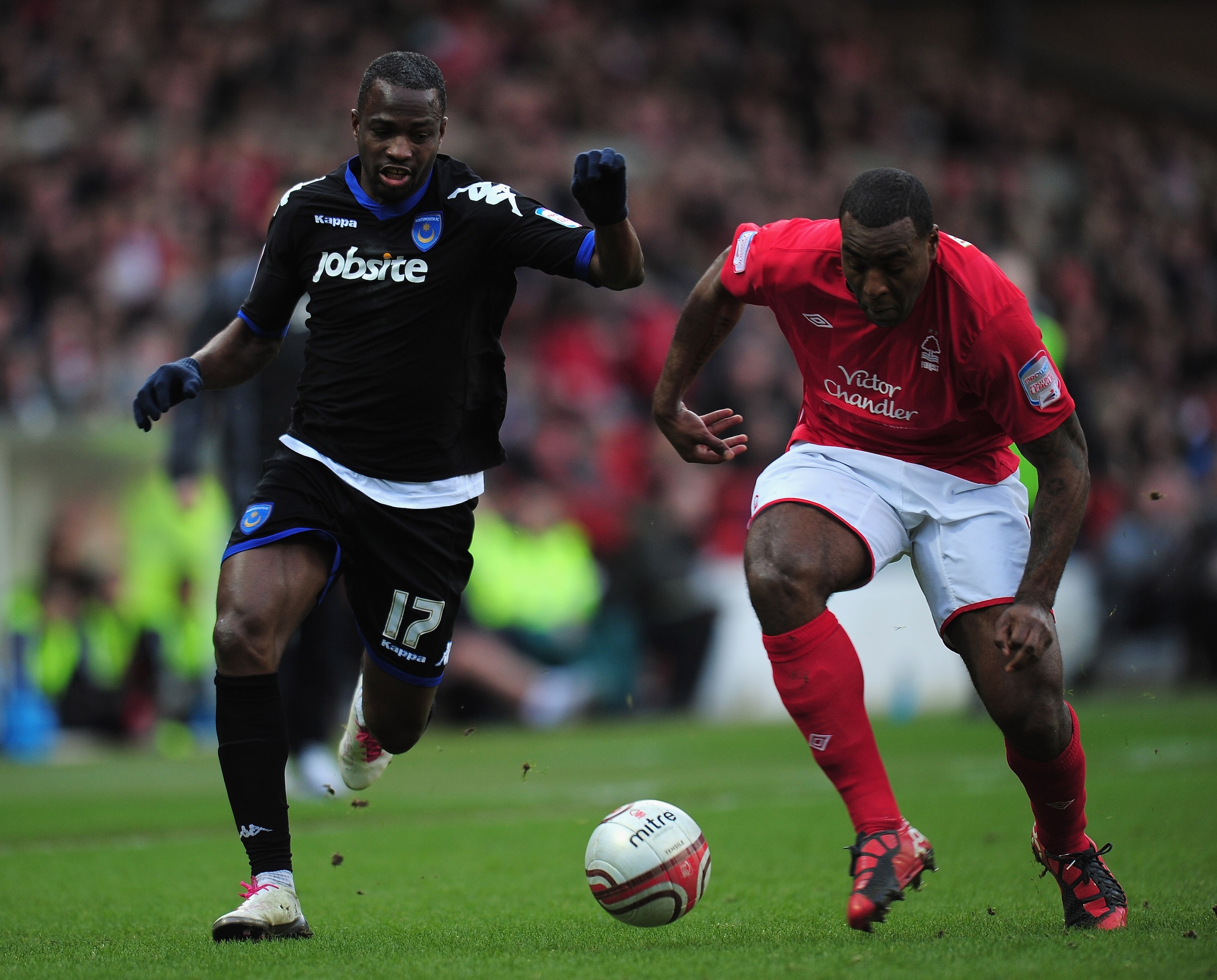 NOTTINGHAM, ENGLAND - JANUARY 15: John Utaka of Portsmouth and Wes Morgan of Nottingham Forest challenge for the ball during the npower Championship match between Nottingham Forest and Portsmouth at the City Ground on January 15, 2011 in Nottingham, Engl NOTTINGHAM, ENGLAND - JANUARY 15: John Utaka of Portsmouth and Wes Morgan of Nottingham Forest challenge for the ball during the npower Championship match between Nottingham Forest and Portsmouth at the City Ground on January 15, 2011 in Nottingham, Engl