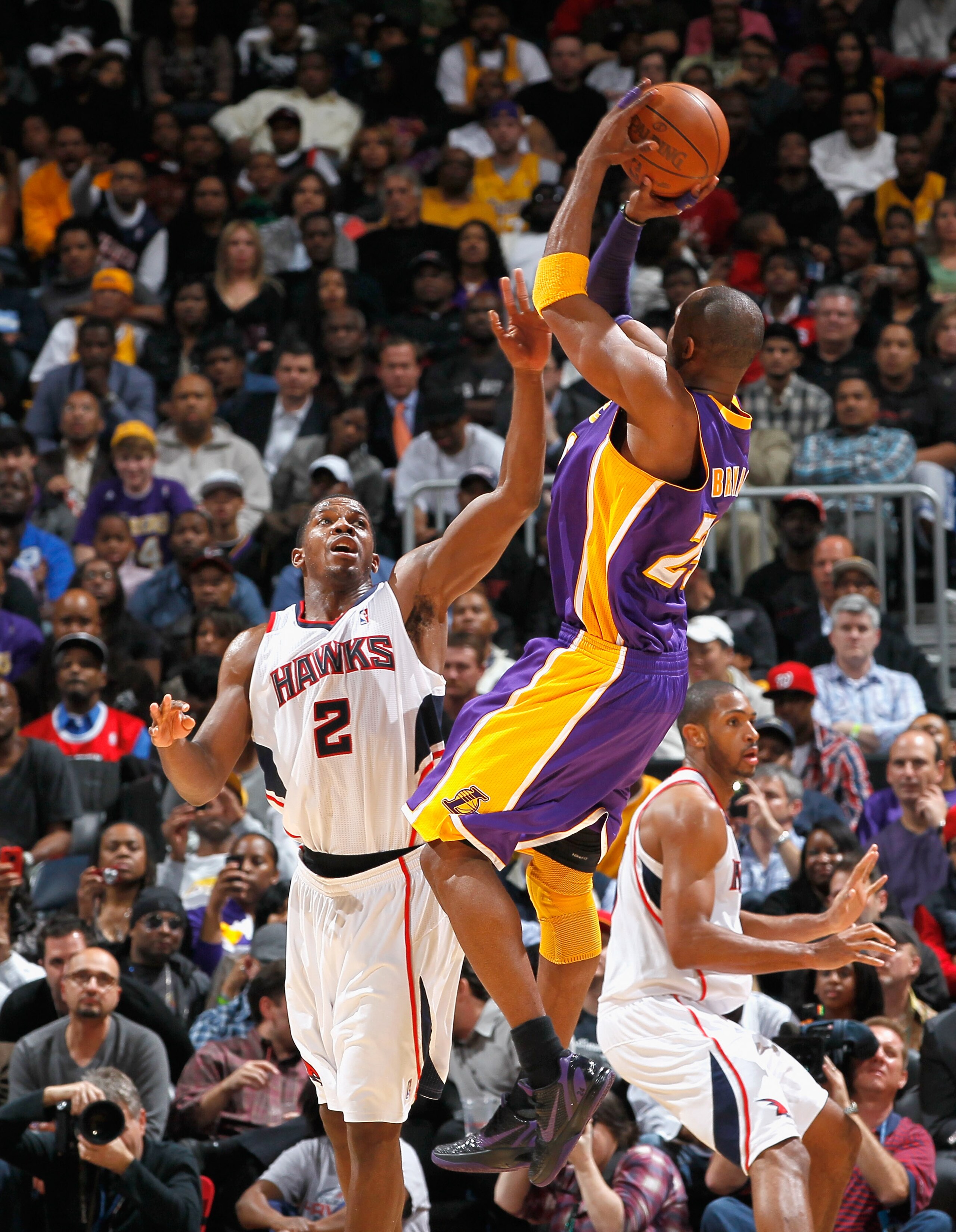 ATLANTA, GA - MARCH 08:  Kobe Bryant #24 of the Los Angeles Lakers shoots against Joe Johnson #2 of the Atlanta Hawks at Philips Arena on March 8, 2011 in Atlanta, Georgia.  NOTE TO USER: User expressly acknowledges and agrees that, by downloading and/or