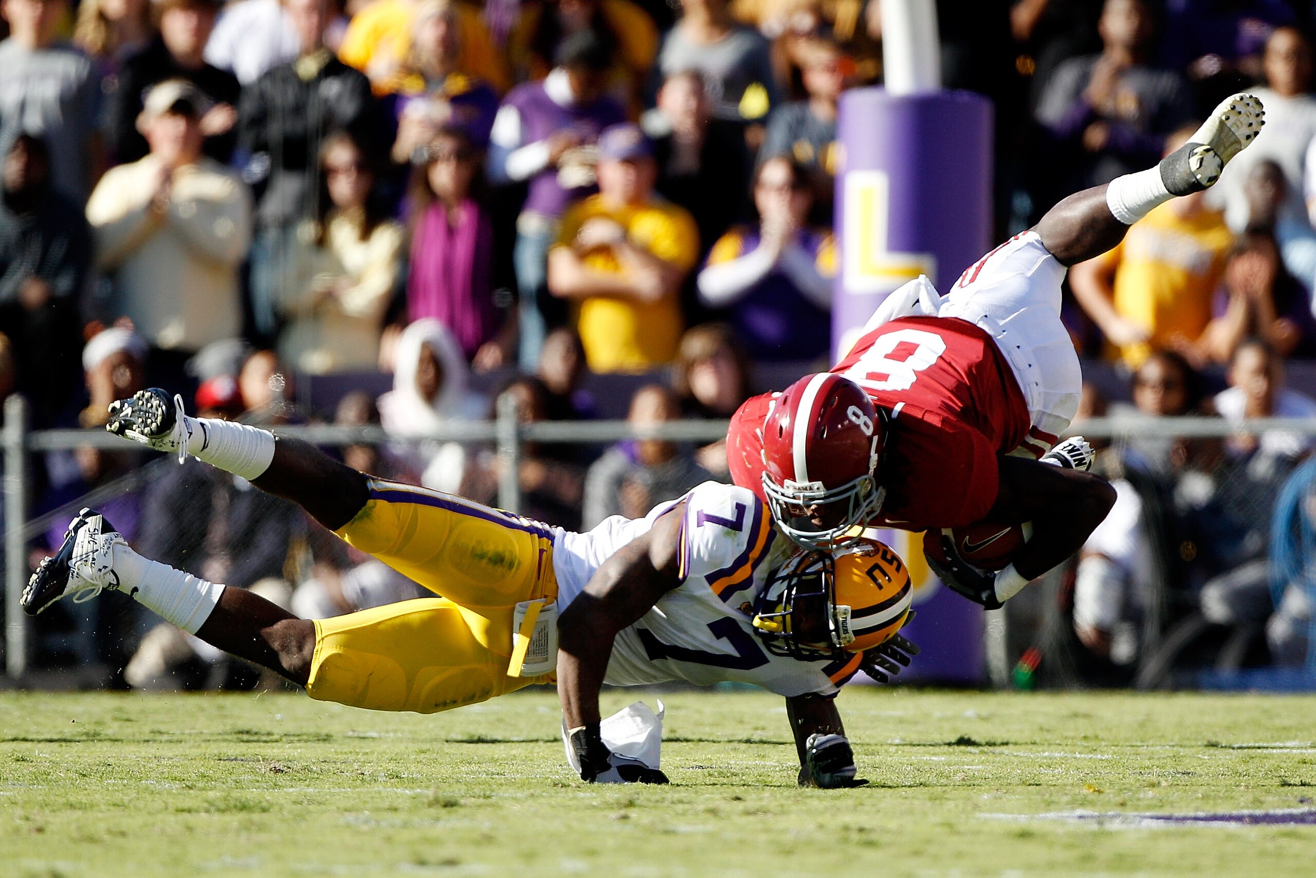 BATON ROUGE, LA - NOVEMBER 06: Julio Jones #8 of the Alabama Crimson Tide is tackled by Patrick Peterson #7 of the Louisiana State University Tigers at Tiger Stadium on November 6, 2010 in Baton Rouge, Louisiana. (Photo by Chris Graythen/Getty Images) BATON ROUGE, LA - NOVEMBER 06: Julio Jones #8 of the Alabama Crimson Tide is tackled by Patrick Peterson #7 of the Louisiana State University Tigers at Tiger Stadium on November 6, 2010 in Baton Rouge, Louisiana. (Photo by Chris Graythen/Getty Images)