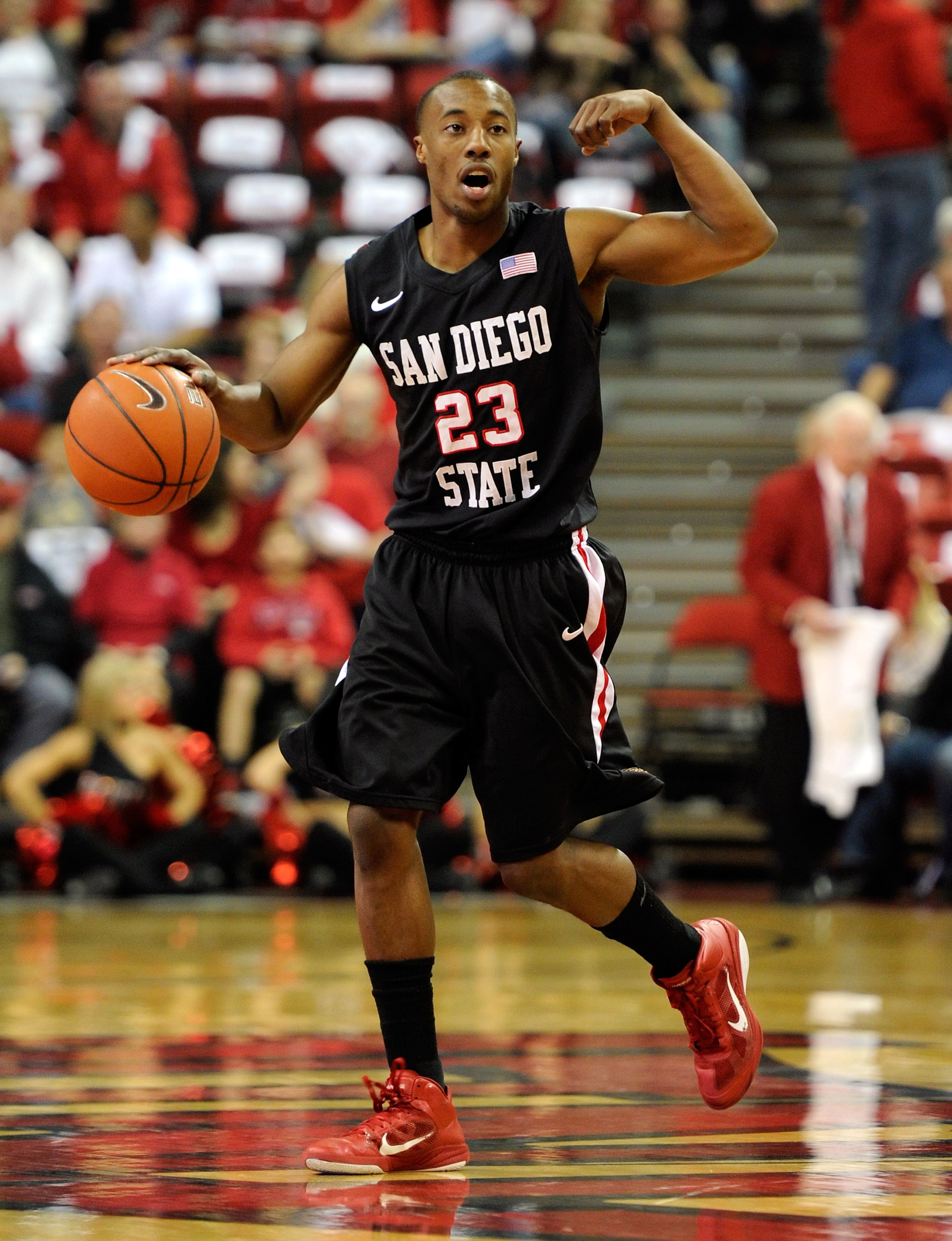 LAS VEGAS, NV - FEBRUARY 12:  D.J. Gay #23 of the San Diego State Aztecs brings the ball up the court during a game against the UNLV Rebels at the Thomas & Mack Center February 12, 2011 in Las Vegas, Nevada. San Diego State won 63-57.  (Photo by Ethan Mil