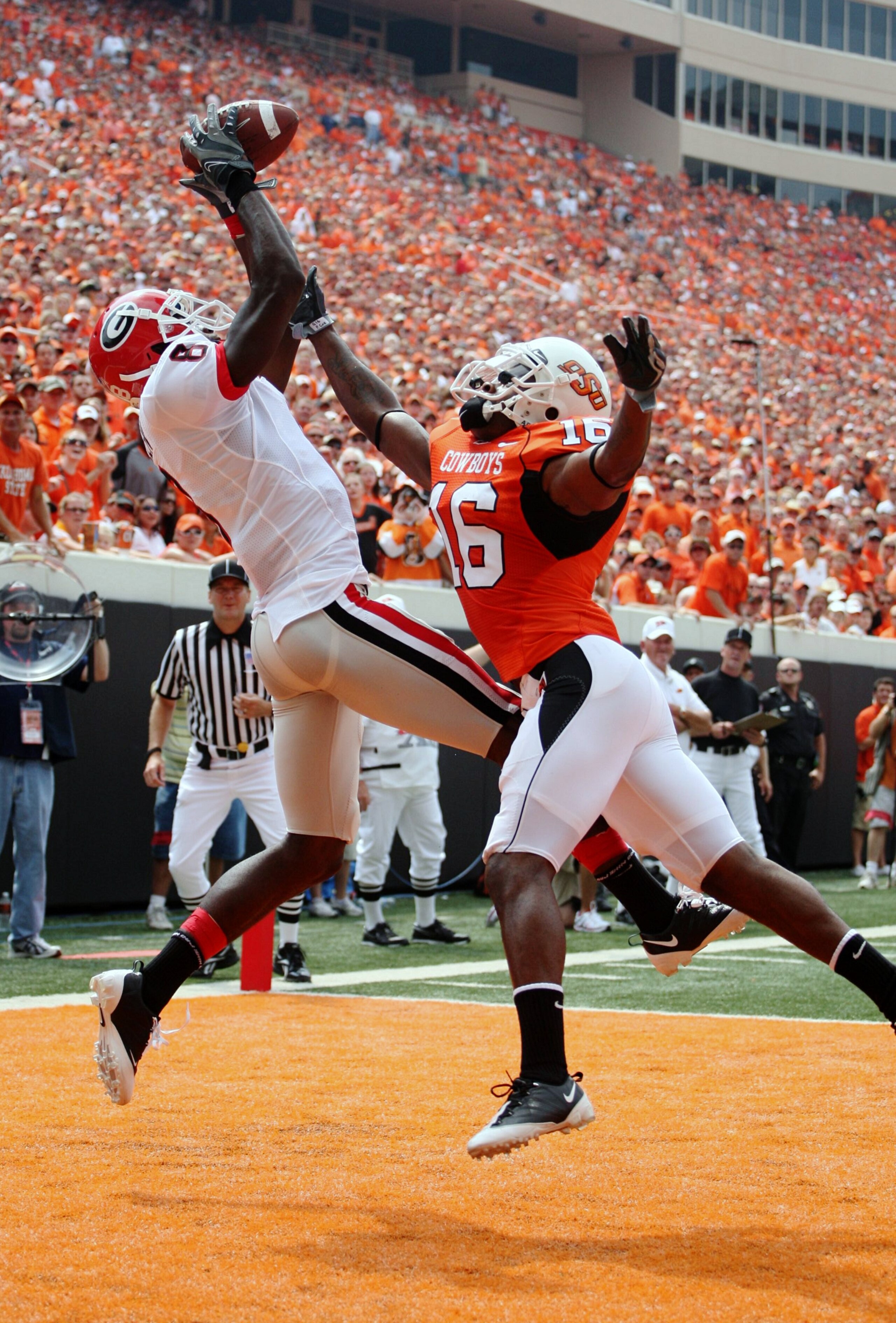 STILLWATER, OK - SEPTEMBER 5:  Wide receiver A.J. Green #8 of the Georgia Bulldogs is unable to hold onto the ball for an incomplete pass in front of Perrish Cox #16 of the Oklahoma State Cowboys during the first quarter of the game at Boone Pickens Stadi
