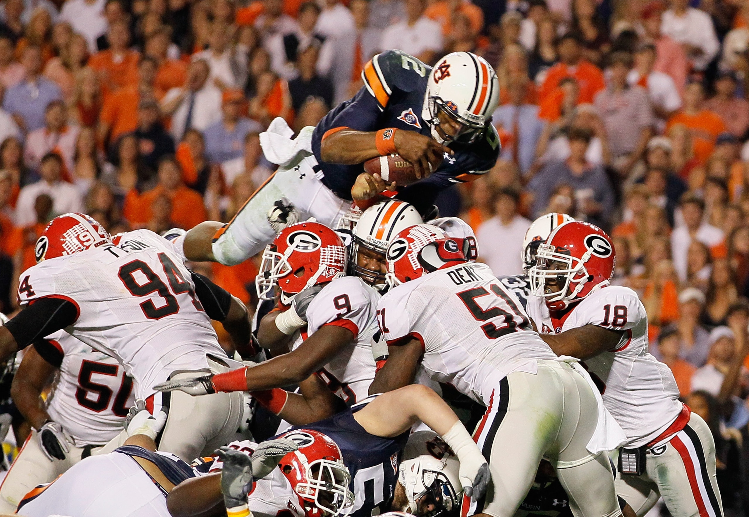AUBURN, AL - NOVEMBER 13:  Quarterback Cameron Newton #2 of the Auburn Tigers dives across the defense for a touchdown against the Georgia Bulldogs at Jordan-Hare Stadium on November 13, 2010 in Auburn, Alabama.  (Photo by Kevin C. Cox/Getty Images)