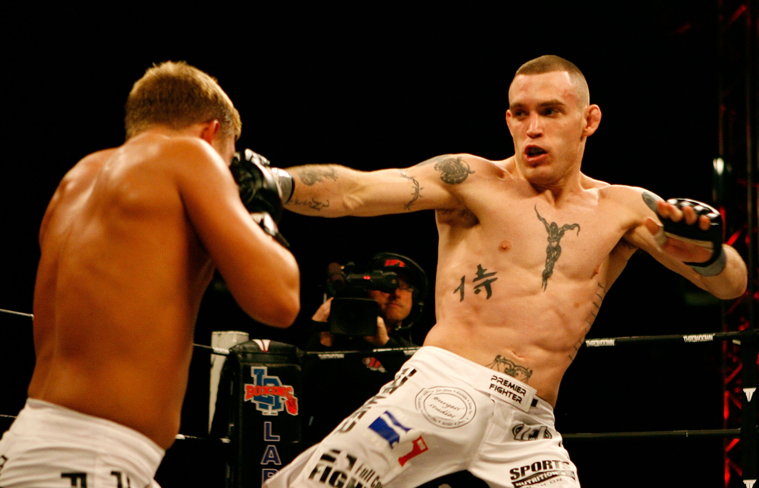 EAST RUTHERFORD, NJ - APRIL 04:  (LtoR) Chris Horodecki in the white trunks of Team Tompkins battles Nate Lamotte in the white trunks of the IFL in the International Fighting League match at the Izod Center in East Rutherford, New Jersey on April 4, 2008.