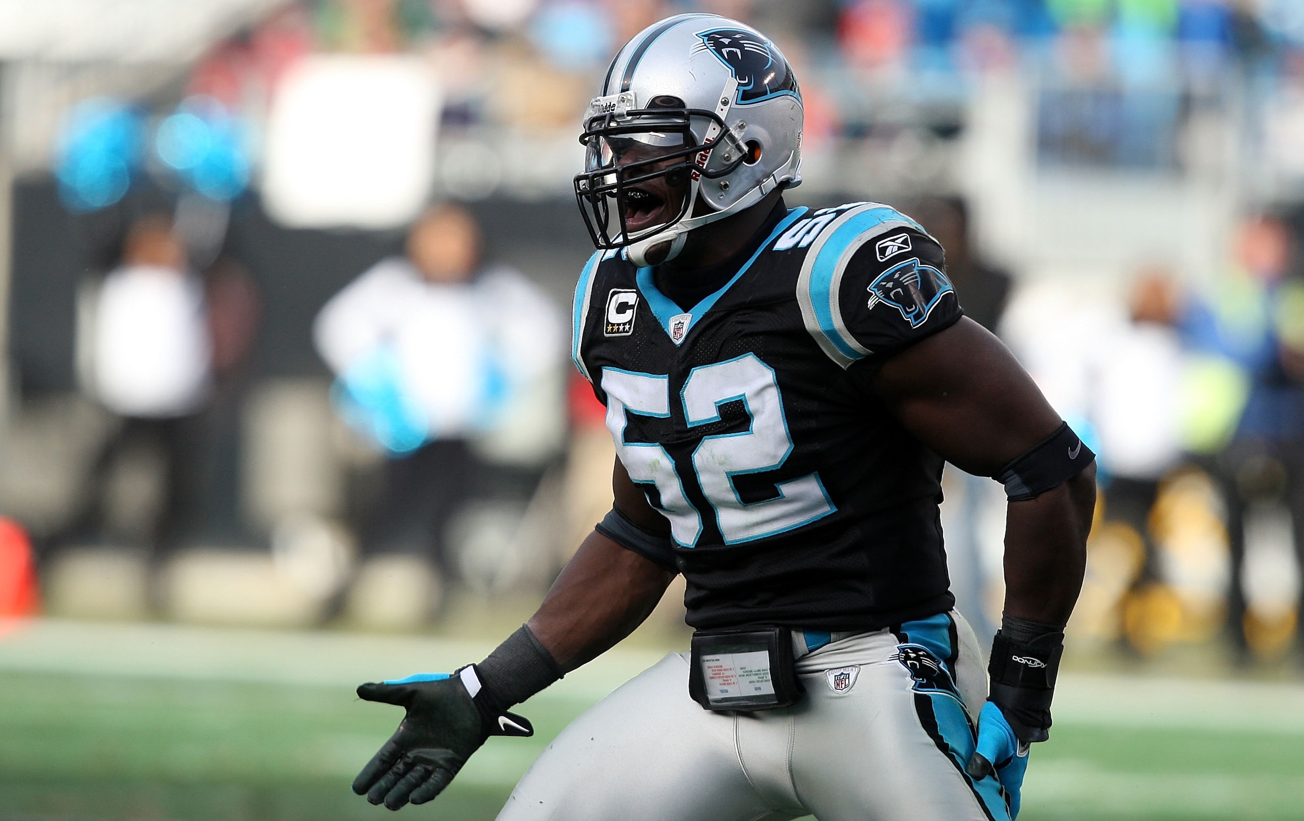 CHARLOTTE, NC - JANUARY 03:  Jon Beason #52 of the Carolina Panthers celebrates after tackle against the New Orleans Saints during their game at Bank of America Stadium on January 3, 2010 in Charlotte, North Carolina.  (Photo by Streeter Lecka/Getty Image
