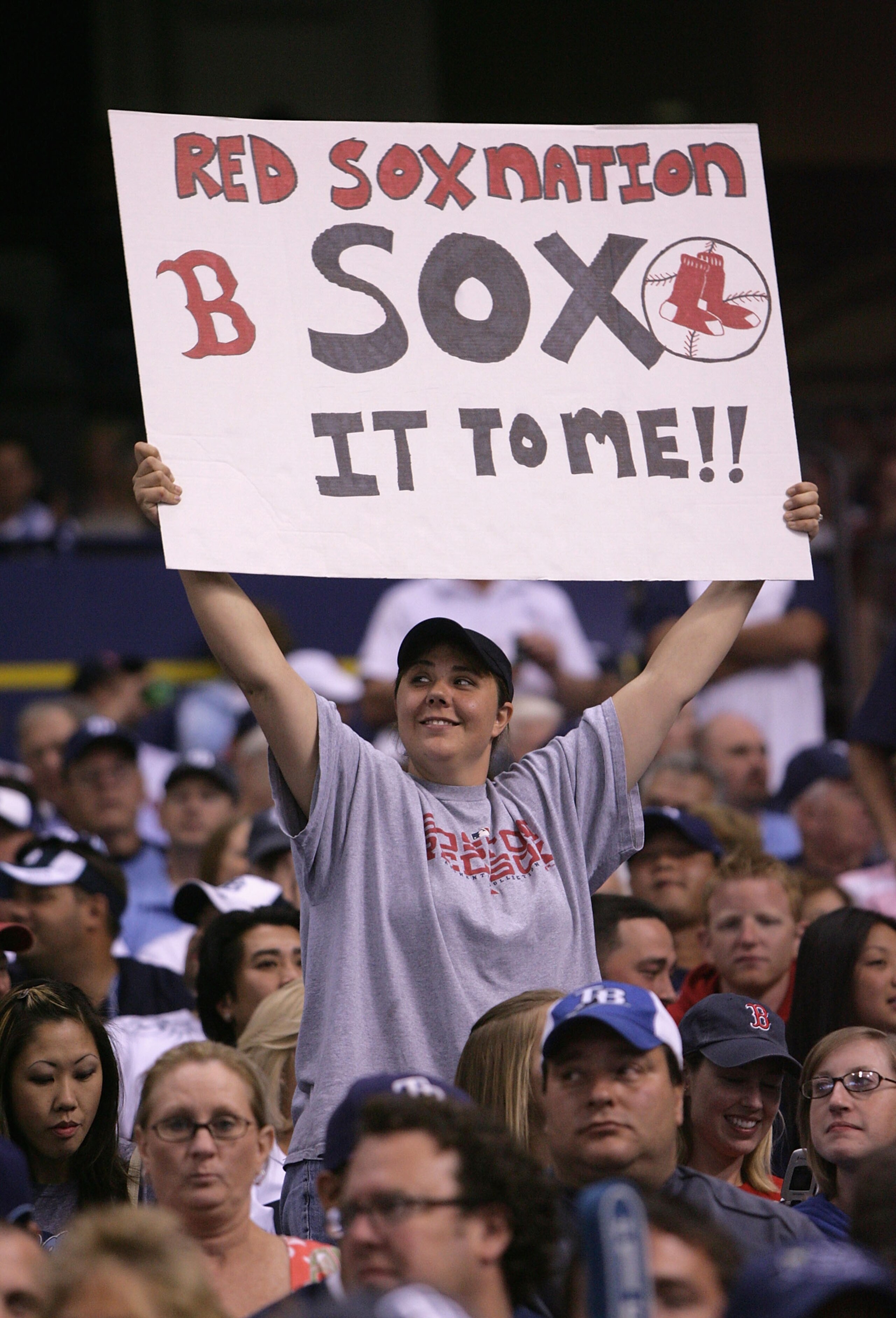 ST PETERSBURG, FL - OCTOBER 19:  A fan of the Boston Red Sox holds up a sign in game seven of the American League Championship Series against the Tampa Bay Rays during the 2008 MLB playoffs on October 19, 2008 at Tropicana Field in St Petersburg, Florida.