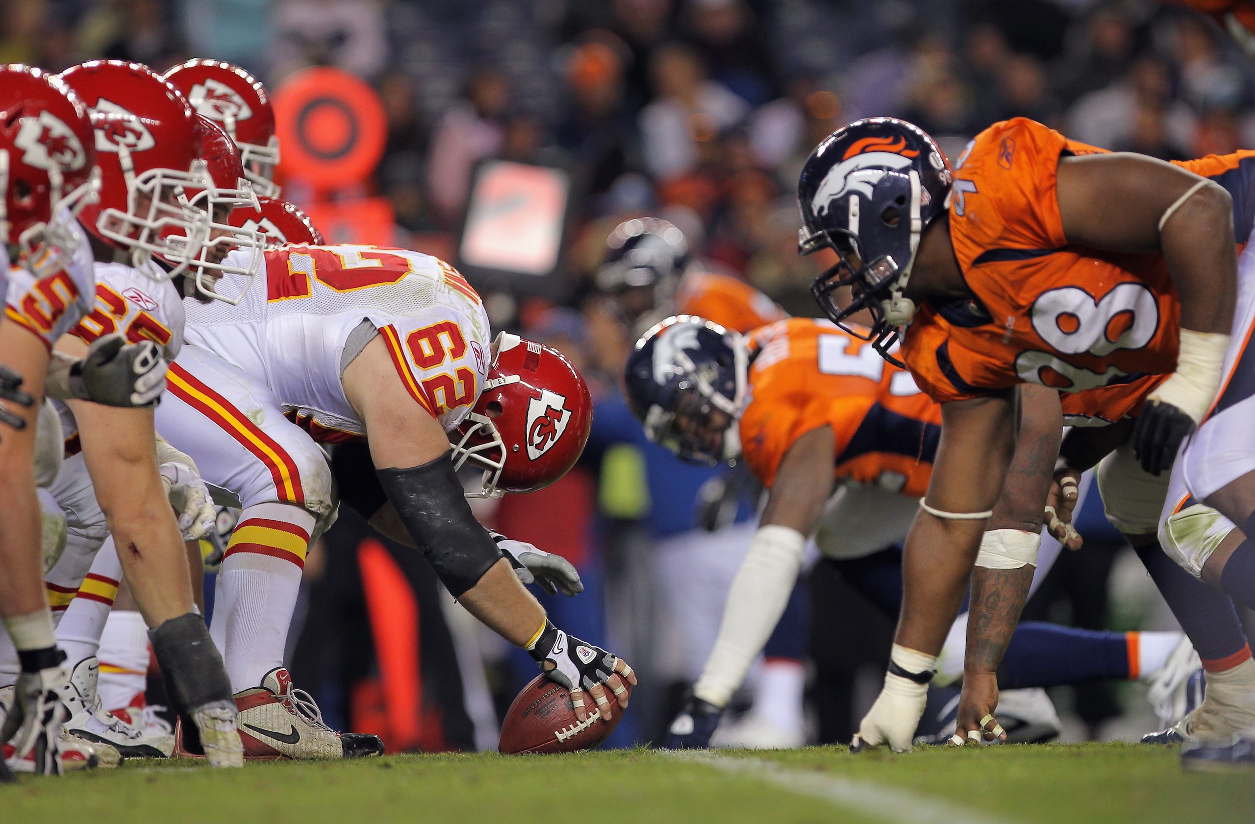 DENVER - NOVEMBER 14:  Center Casey Wiegman #62 of the Kansas City Chiefs snaps the ball as the Chiefs offensive line takes on the defensive line of the Denver Bronco at INVESCO Field at Mile High on November 14, 2010 in Denver, Colorado. The Broncos defe
