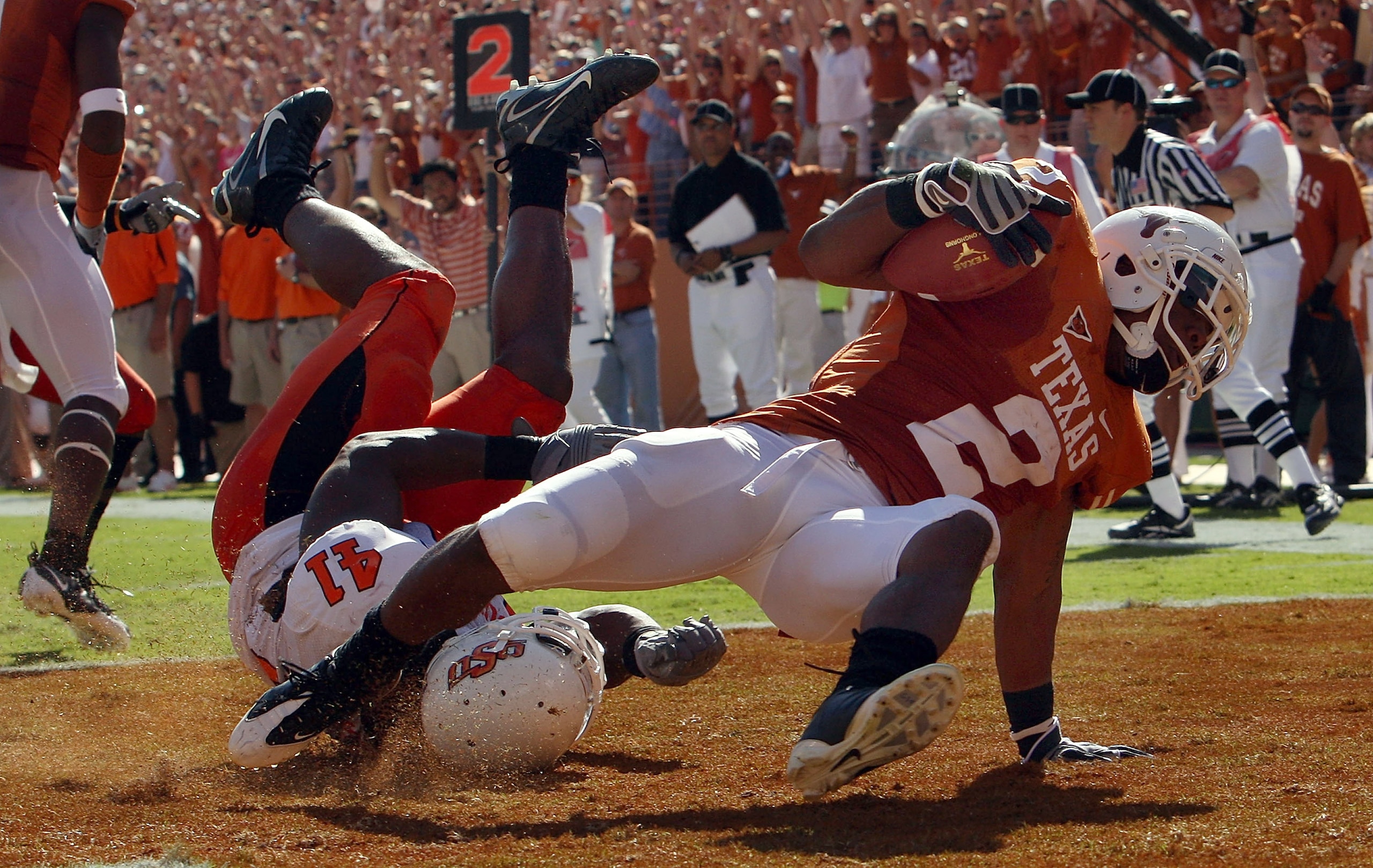 AUSTIN, TX - OCTOBER 25:   Running back Vondrell McGee #2 of the Texas Longhorns runs for a touchdown against Orie Lemon #41 of the Oklahoma State Cowboys at Texas Memorial Stadium on October 25, 2008 in Austin, Texas.  (Photo by Ronald Martinez/Getty Ima