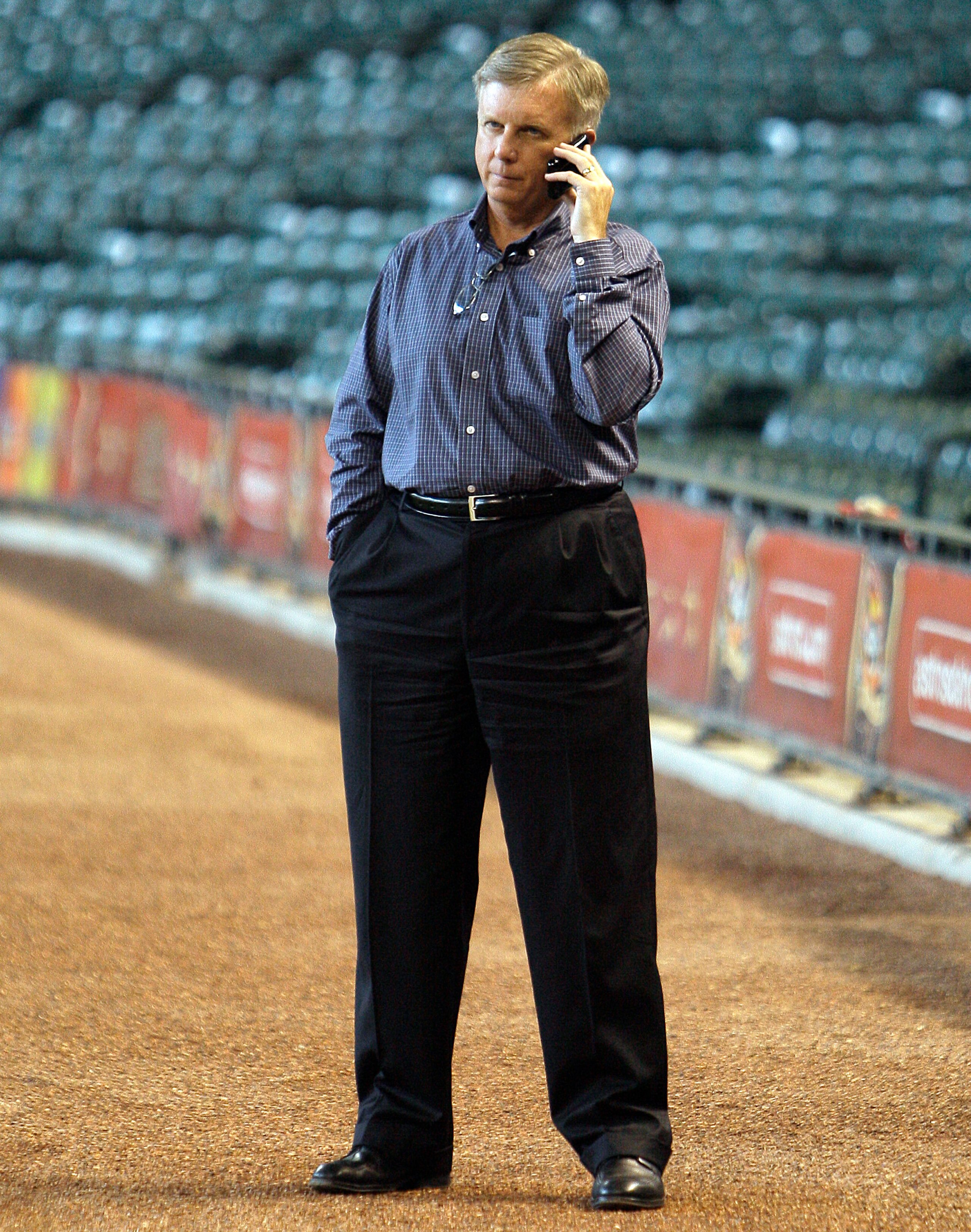 HOUSTON - JULY 23:  Houston Astros general manager Ed Wade talks on the phone during battting practice before a game against the Cincinnati Reds at Minute Maid Park on July 23, 2010 in Houston, Texas.  (Photo by Bob Levey/Getty Images)