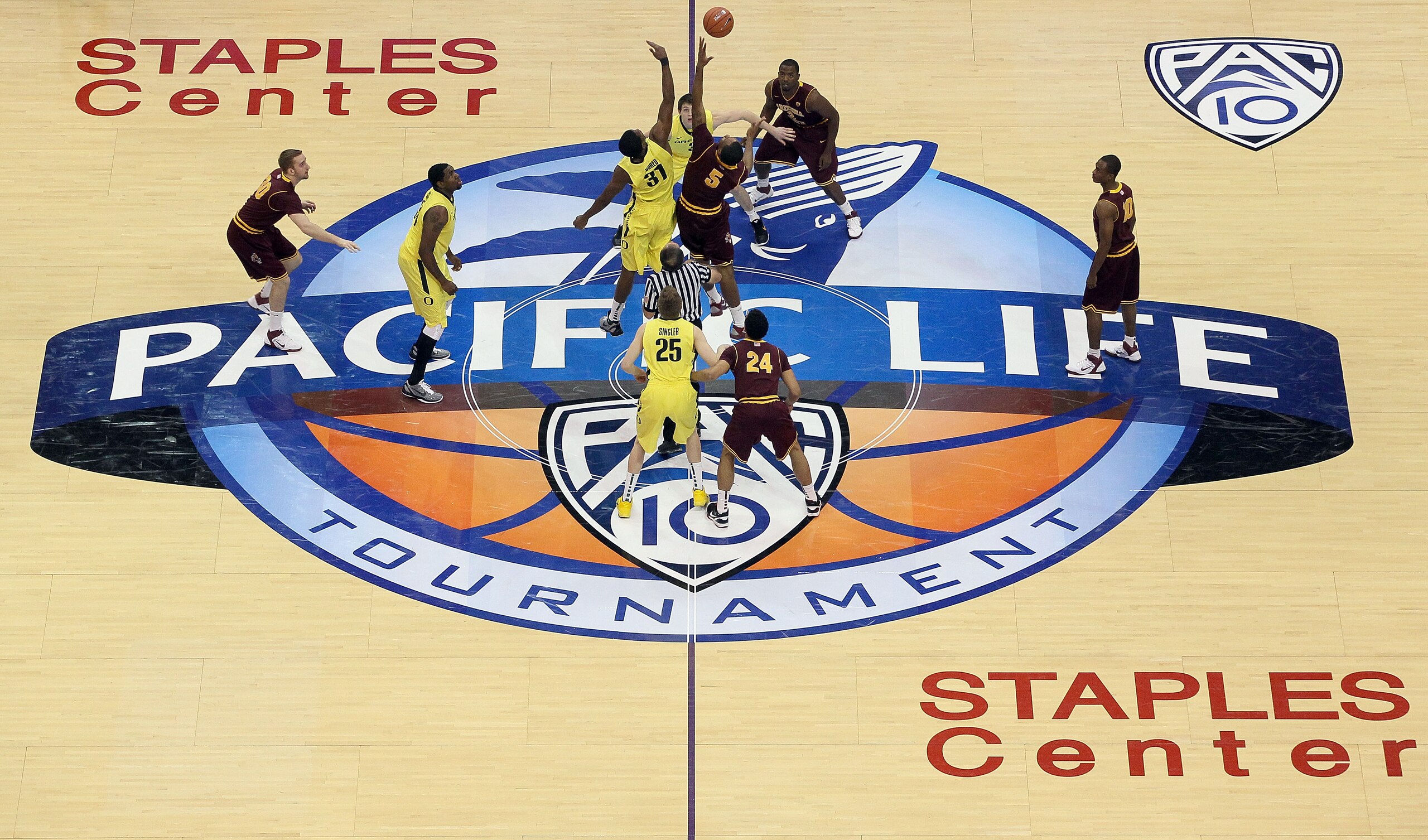 LOS ANGELES, CA - MARCH 09:  Tyrone Nared #31 of the Oregon Ducks goes up for the opening tip-off against Kyle Cain #5 of the Arizona State Sun Devils in the first round of the 2011 Pacific Life Pac-10 Men's Basketball Tournament at Staples Center on Marc