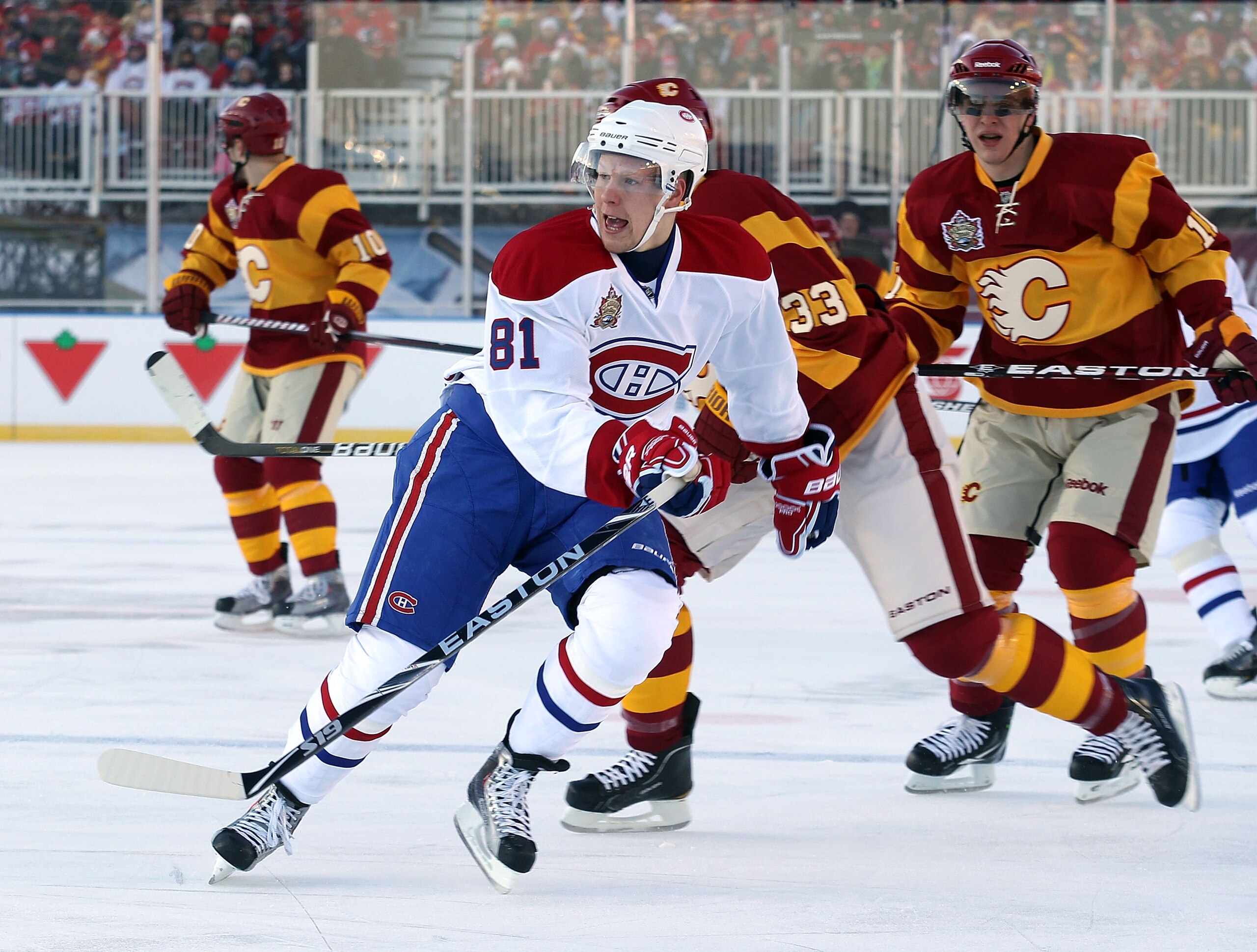 CALGARY, AB - FEBRUARY 20: Lars Eller #81 of the Montreal Canadiens skates against the Calgary Flames during the 2011 NHL Heritage Classic Game at McMahon Stadium on February 20, 2011 in Calgary, Alberta, Canada. The Flames defeated the Canadiens 4-0.  (P