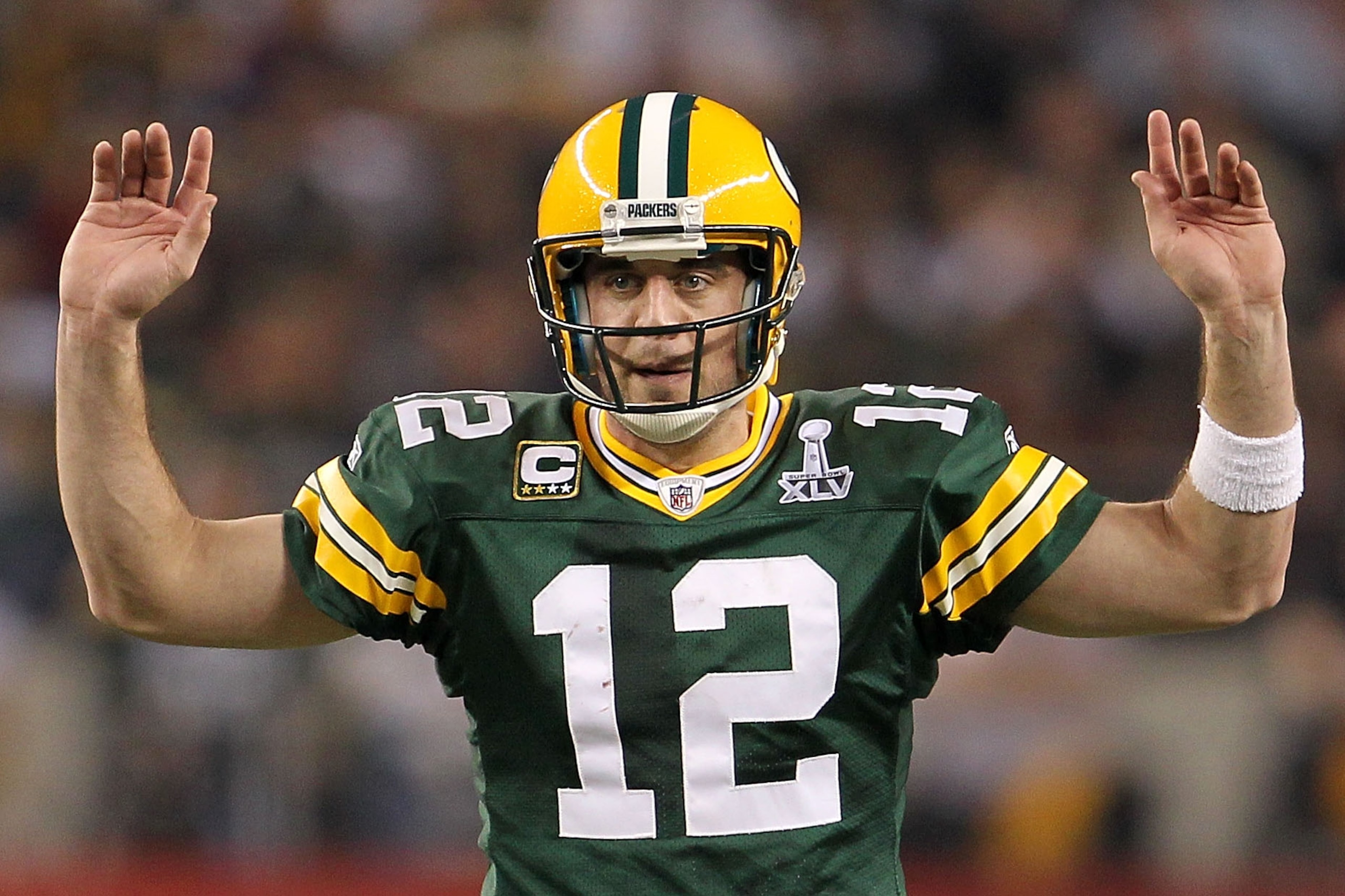 ARLINGTON, TX - FEBRUARY 06:  Quarterback Aaron Rodgers #12 of the Green Bay Packers calls out from under center against the Pittsburgh Steelers during Super Bowl XLV at Cowboys Stadium on February 6, 2011 in Arlington, Texas.  (Photo by Jamie Squire/Gett