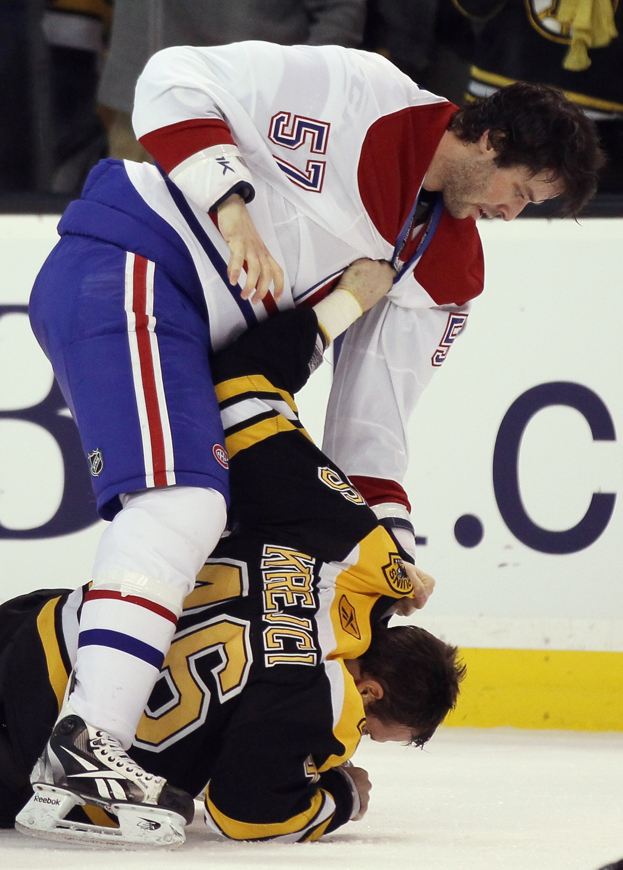 BOSTON, MA - FEBRUARY 09:  Benoit Pouliot #57 of the Montreal Canadiens hits David Krejci #46 of the Boston Bruins on February 9, 2011 at the TD Garden in Boston, Massachusetts. The Bruins defeated the Canadiens 8-6.  (Photo by Elsa/Getty Images)