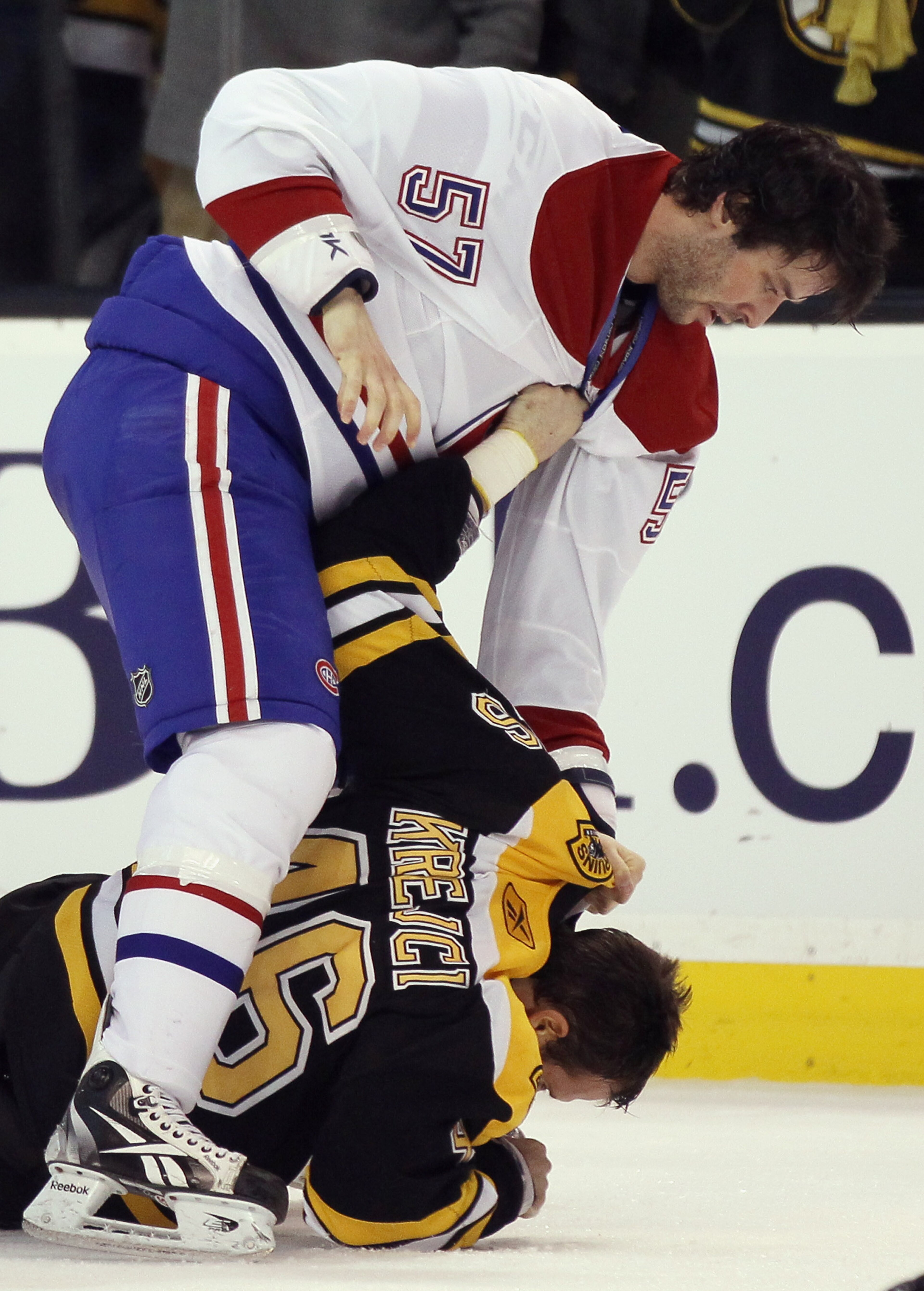 BOSTON, MA - FEBRUARY 09:  Benoit Pouliot #57 of the Montreal Canadiens hits David Krejci #46 of the Boston Bruins on February 9, 2011 at the TD Garden in Boston, Massachusetts. The Bruins defeated the Canadiens 8-6.  (Photo by Elsa/Getty Images)