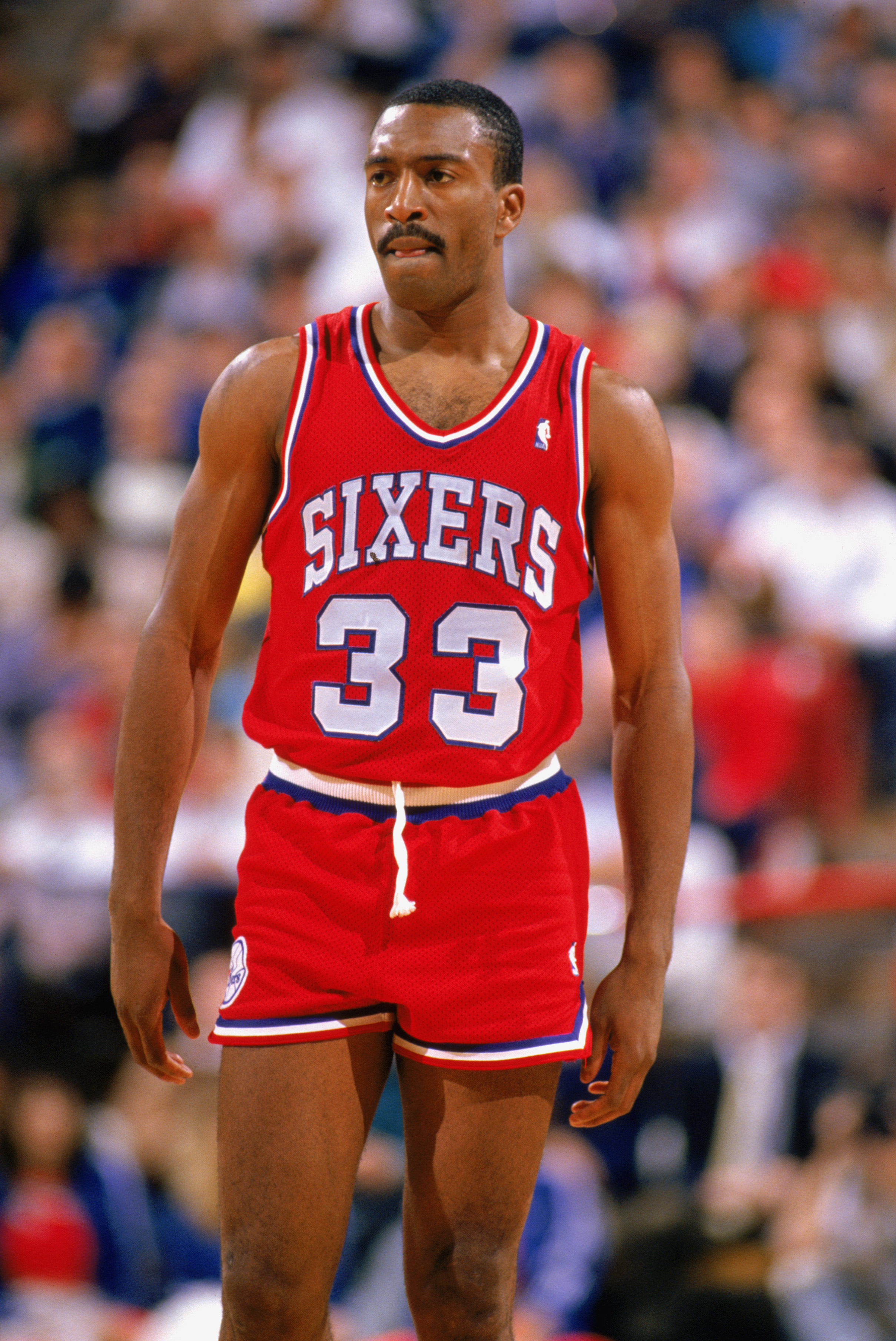 1989:  Hersey Hawkins #33 of the Philadelphia 76ers walks on the court during the 1988-1989 NBA season.  (Photo by Otto Greule Jr/Getty Images)