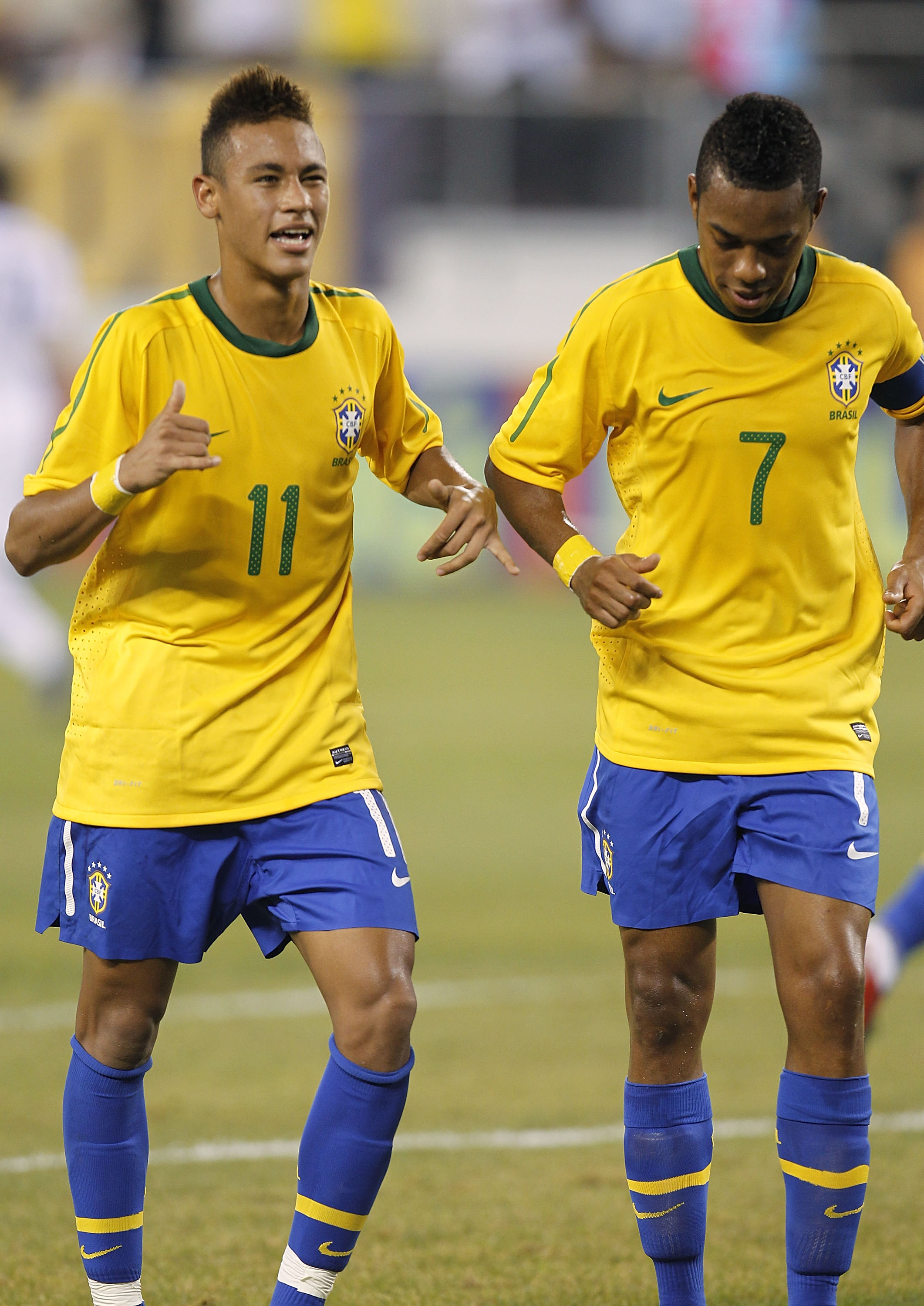 EAST RUTHERFORD, NJ - AUGUST 10: Neymar #11 and Robinho #7 of Brazil celebrate Neymar's goal against the U.S. in the first half of a friendly match at the New Meadowlands on August 10, 2010 in East Rutherford, New Jersey. (Photo by Jeff Zelevansky/Getty I