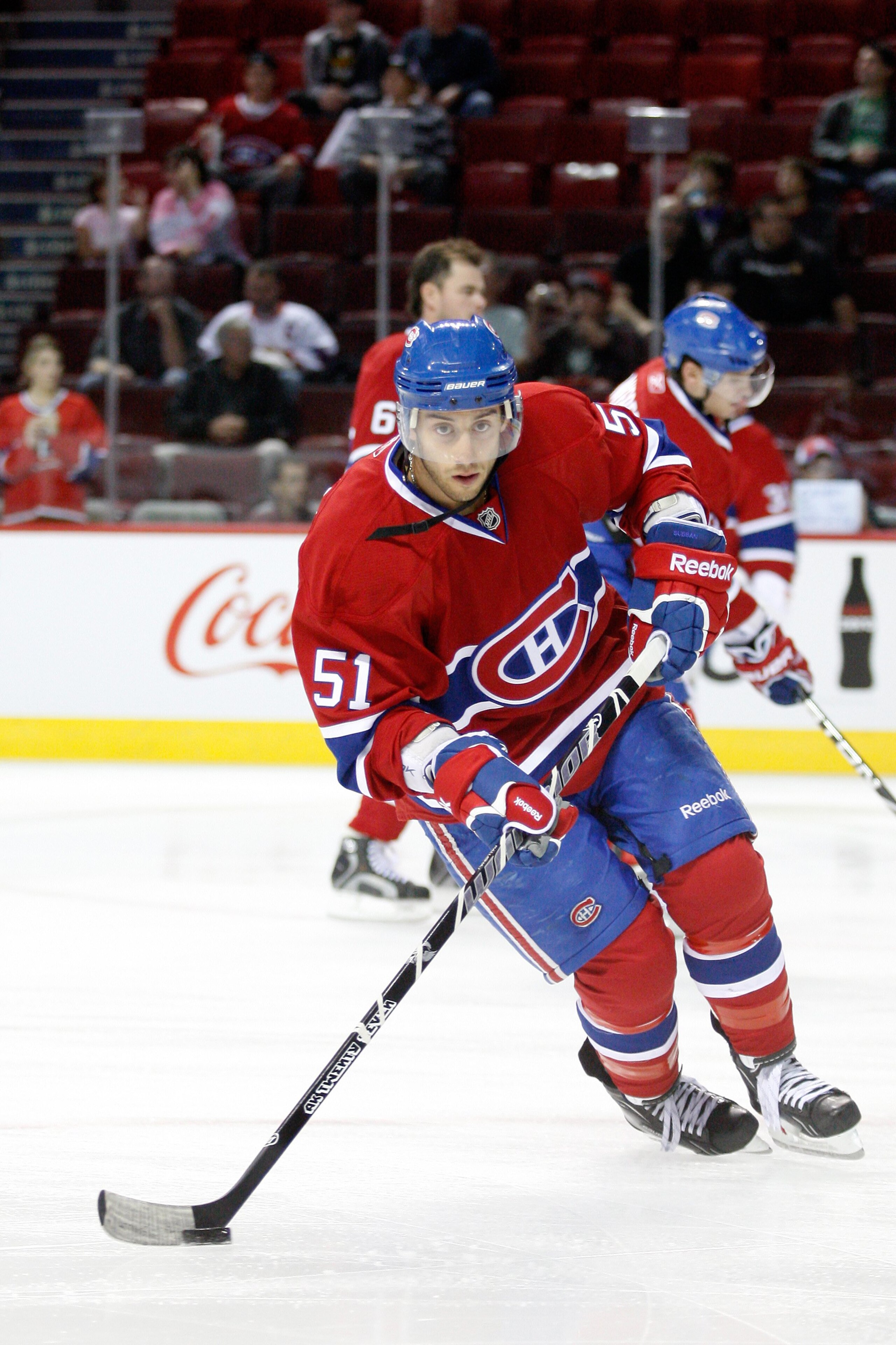 MONTREAL- SEPTEMBER 22:  Aaron Palushaj #51 of the Montreal Canadiens skates with the puck during the warm up period prior to facing the Boston Bruins in an NHL pre-season game at the Bell Centre on September 22, 2010 in Montreal, Quebec, Canada.  The Bru