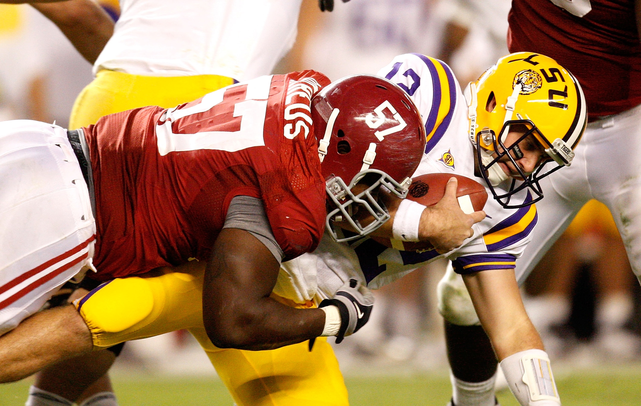 TUSCALOOSA, AL - NOVEMBER 07:  Marcell Dareus #57 of the Alabama Crimson Tide sacks quarterback Jarrett Lee #12 of the Louisiana State University Tigers at Bryant-Denny Stadium on November 7, 2009 in Tuscaloosa, Alabama.  (Photo by Kevin C. Cox/Getty Imag