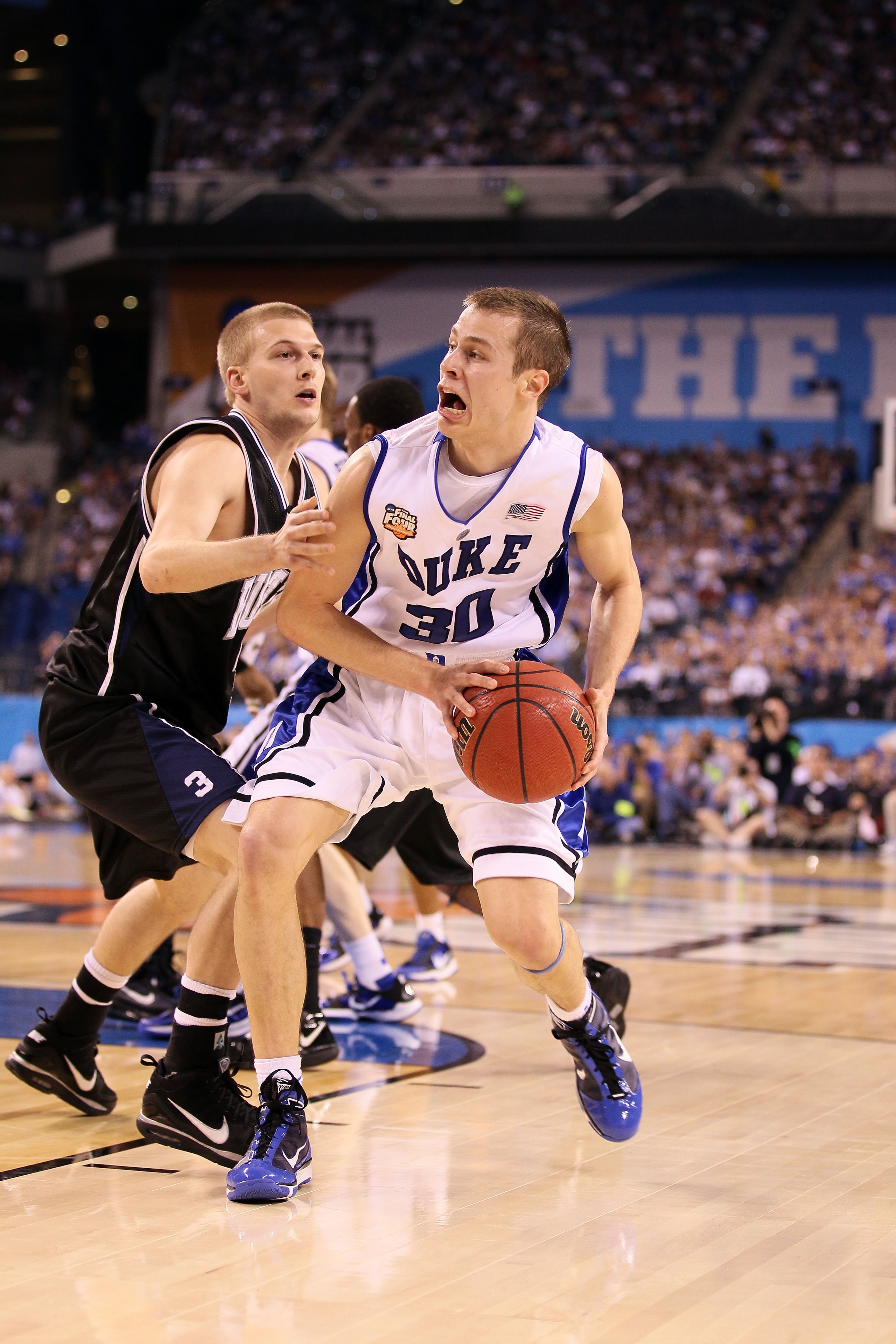 INDIANAPOLIS - APRIL 05:  Jon Scheyer #30 of the Duke Blue Devils drives against Zach Hahn #3 of the Butler Bulldogs during the 2010 NCAA Division I Men's Basketball National Championship game at Lucas Oil Stadium on April 5, 2010 in Indianapolis, Indiana