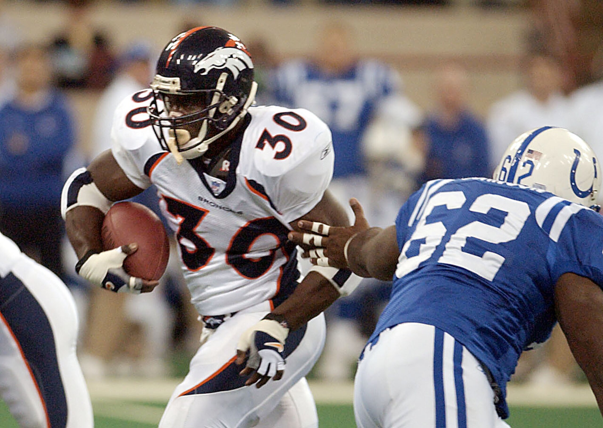 06 Jan 2002: Terrell Davis #30 of the Denver Broncos runs out the reach of Ellis Johnson #62 of the Indianapolis Colts during their NFL game at the RCA Dome in Indianapplis on Sunday. Mandatory Credit: Ron Hoskins\\Getty Images 06 Jan 2002: Terrell Davis #30 of the Denver Broncos runs out the reach of Ellis Johnson #62 of the Indianapolis Colts during their NFL game at the RCA Dome in Indianapplis on Sunday. Mandatory Credit: Ron Hoskins\\Getty Images