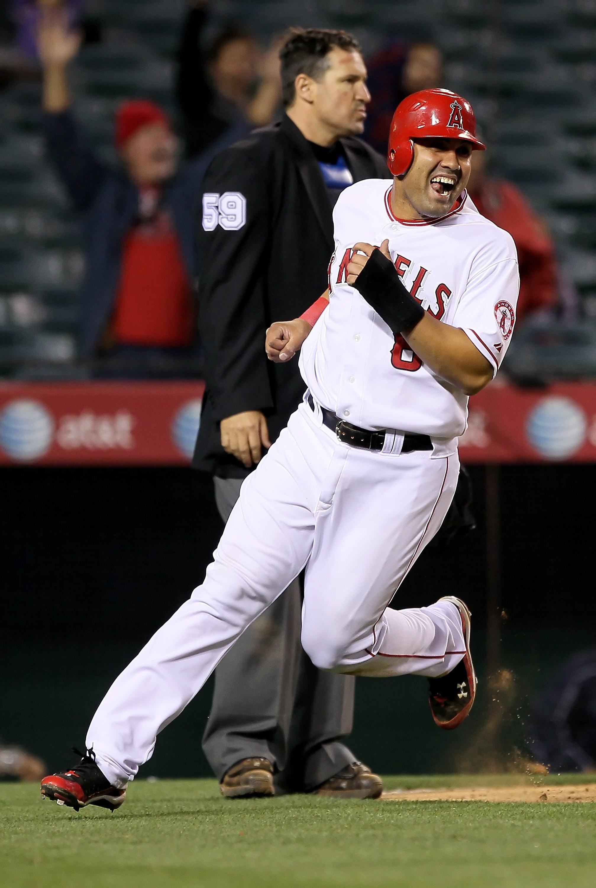 ANAHEIM, CA - MAY 10:  Kendry Morales #8 of the Los Angeles Angels of Anaheim scores the game winning run against the Tampa Bay Rays at Angel Stadium on May 10, 2010 in Anaheim, California.  (Photo by Jeff Gross/Getty Images)