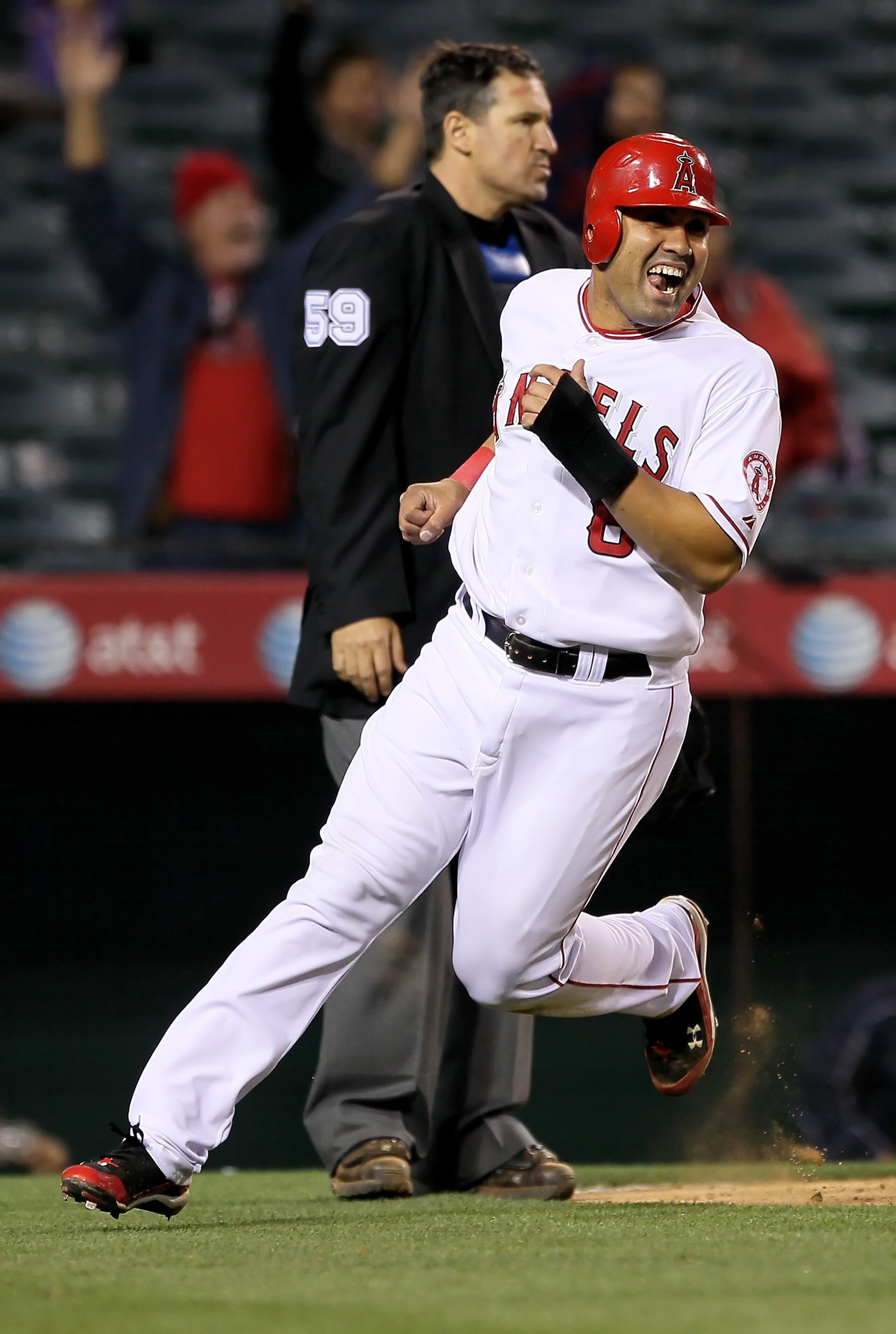 ANAHEIM, CA - MAY 10:  Kendry Morales #8 of the Los Angeles Angels of Anaheim scores the game winning run against the Tampa Bay Rays at Angel Stadium on May 10, 2010 in Anaheim, California.  (Photo by Jeff Gross/Getty Images)