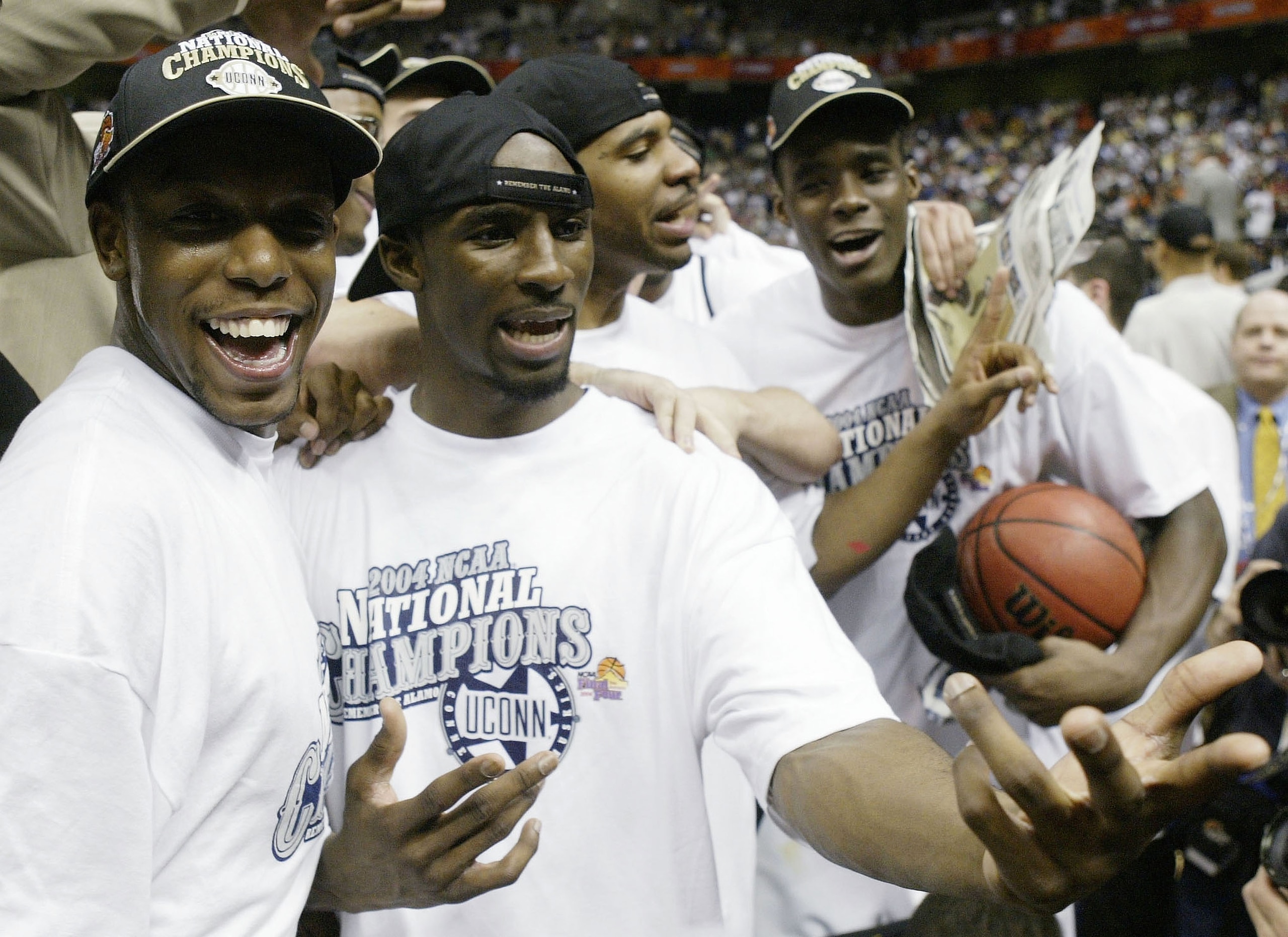 SAN ANTONIO - APRIL 5:  (L-R) Taliek Brown #12, Ben Gordon #4 and Emeka Okafor #50 of the UConn Huskies celebrate after defeating the Georgia Tech Yellow Jackets 82-73 during the National Championship game of the NCAA Men's Final Four Tournament at the Al